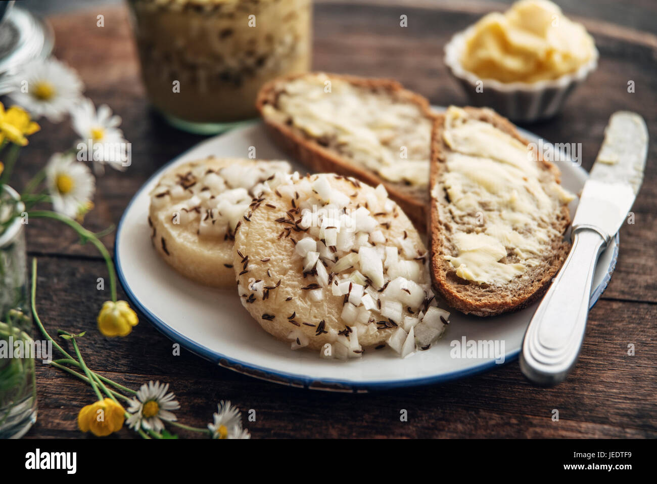 Traditional hessian 'Handkäs mit Musik', regional speciality with a strong smelling cheese, vinegar, oil, onions and caraway seeds Stock Photo