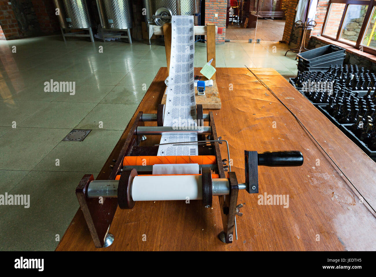 Label printing machine in winery, Batumi, Georgia. Stock Photo