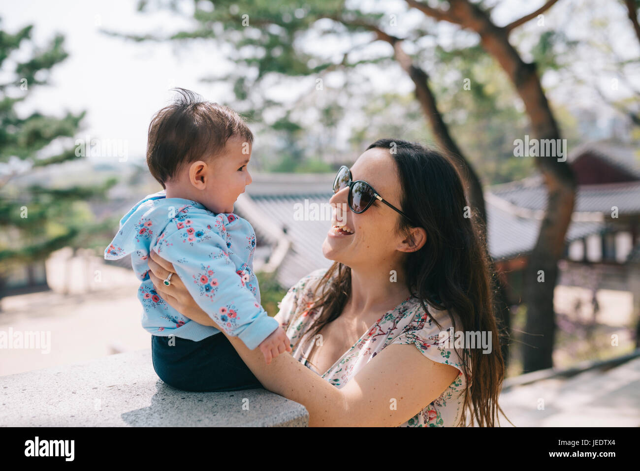 South Korea, Seoul, Mother and baby girl visiting Changdeokgung Palace and Huwon Stock Photo