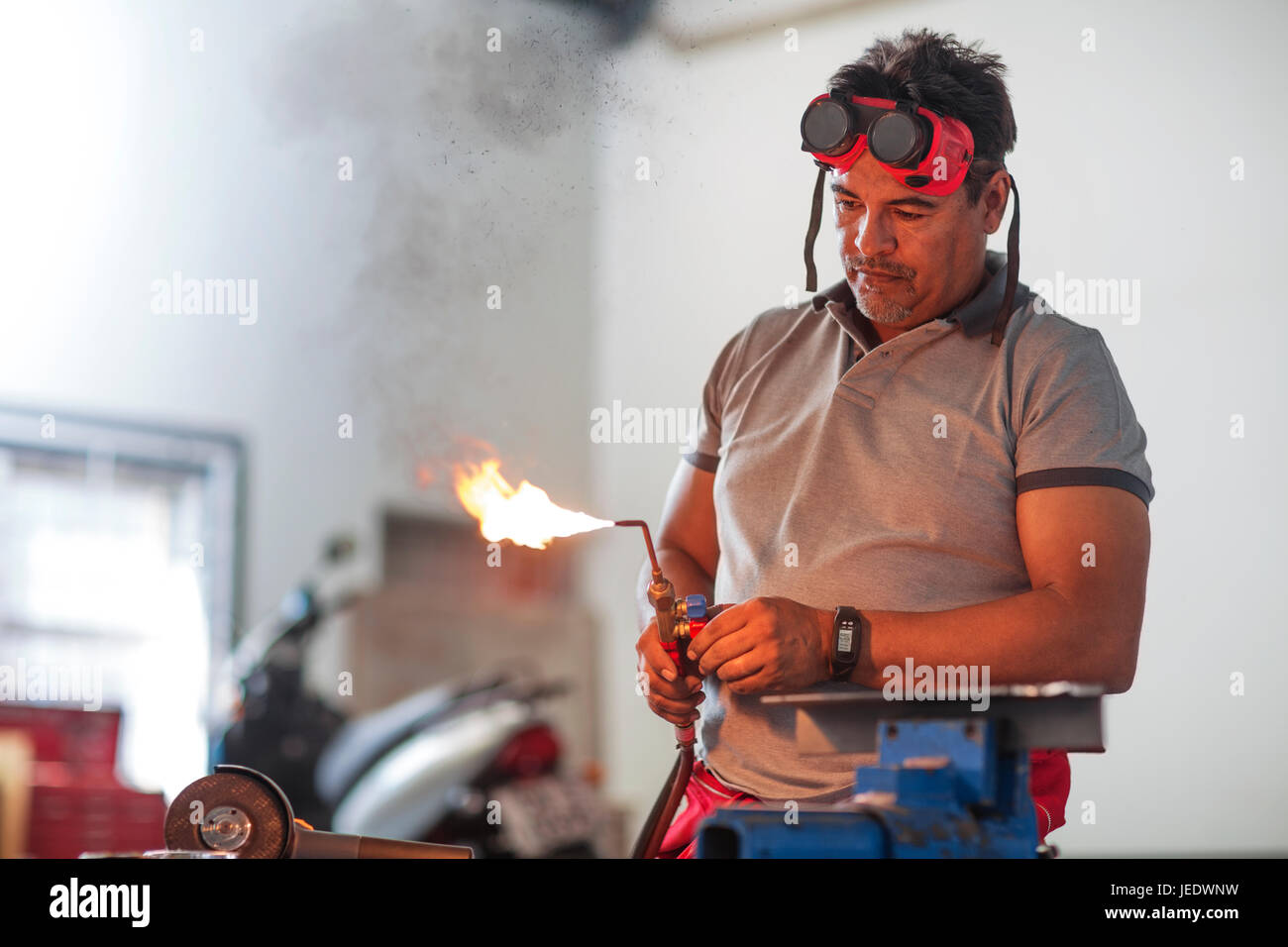 Mechanic welding in car Stock Photo Alamy