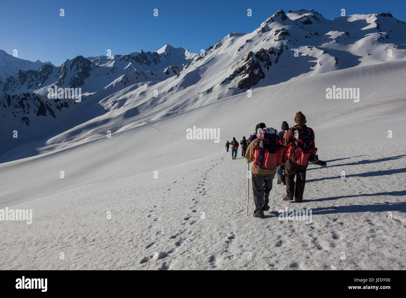 Group of trekkers hiking in Himalayas for Sarpass Trek in Kasol, Himachal Pradesh, India Stock Photo