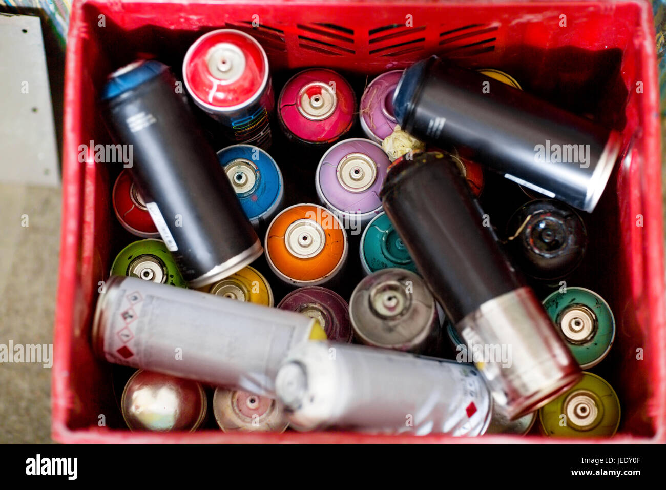 Spray paint cans in plastic crate Stock Photo Alamy