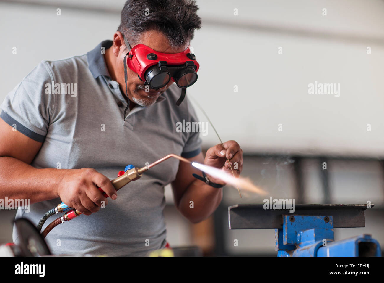 Mechanic welding in car Stock Photo Alamy