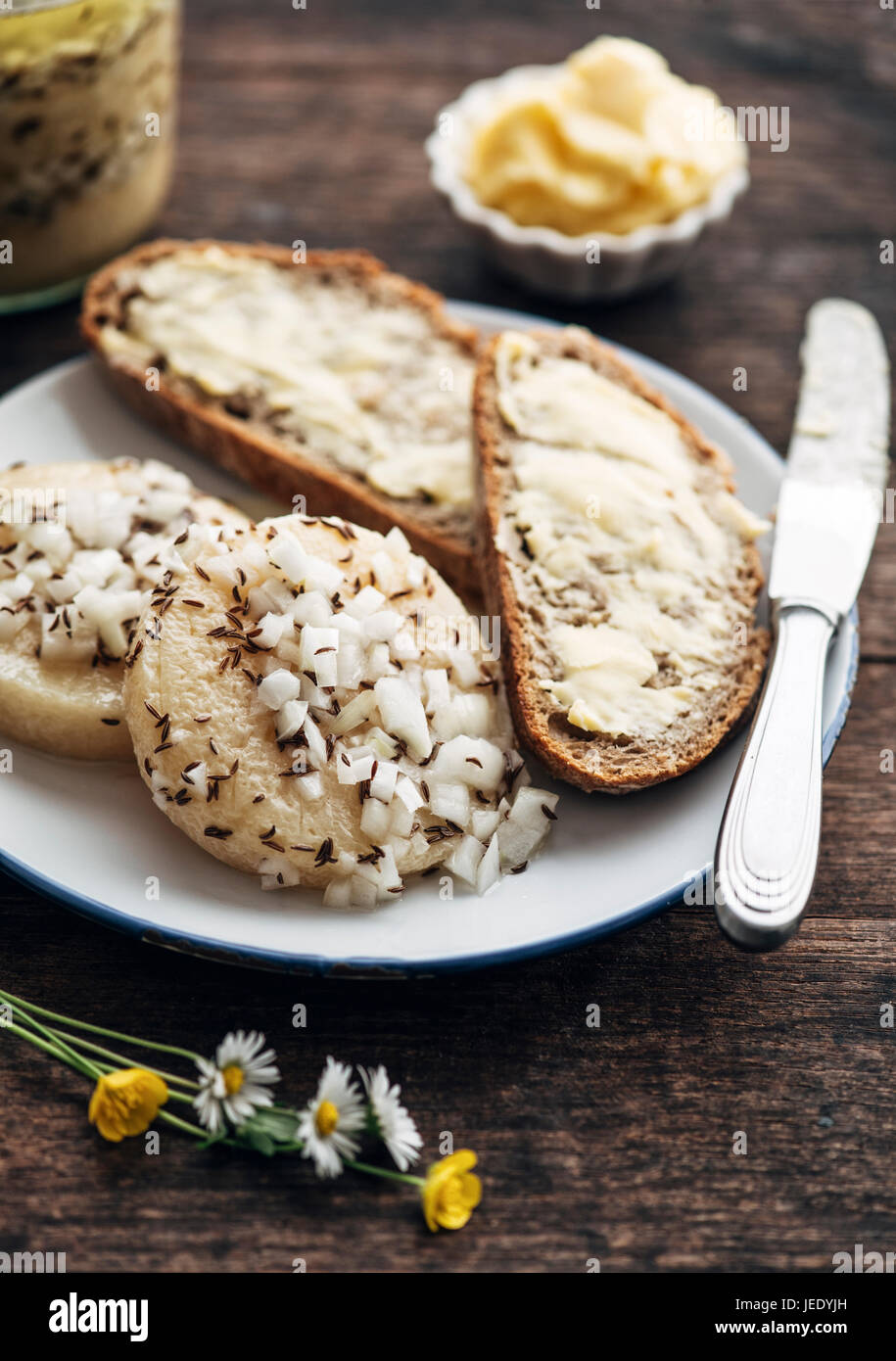 Traditional hessian 'Handkäs mit Musik', regional speciality with a strong smelling cheese, vinegar, oil, onions and caraway seeds Stock Photo