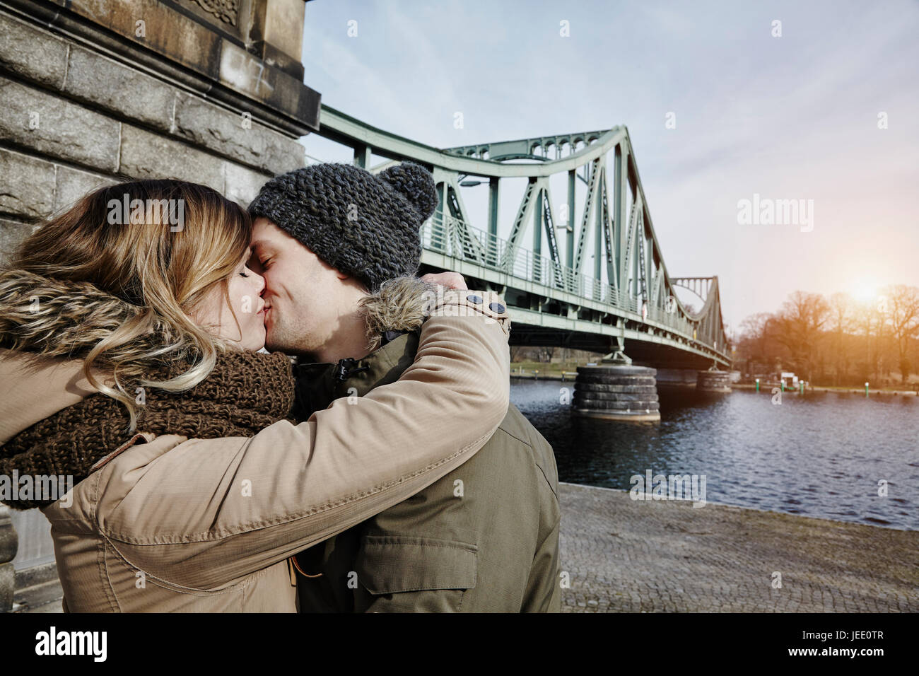 Young couple kissing at glienicke bridge hi res stock photography and