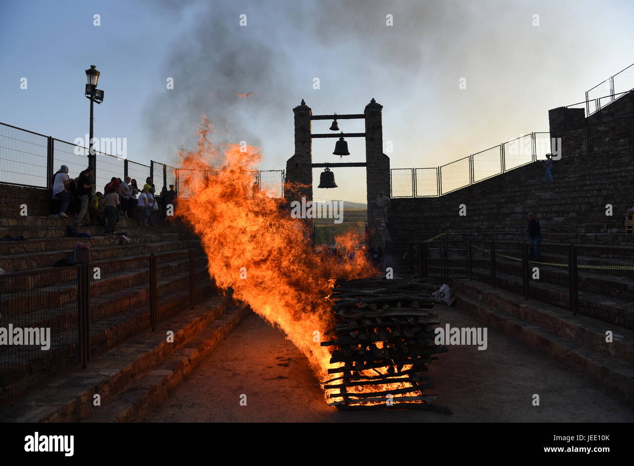People view a fire before walking on the burning embers during the night of San Juan in San Pedro Manrique, northern Spain. (Photo byJorge Sanz/Pacific Press) Stock Photo