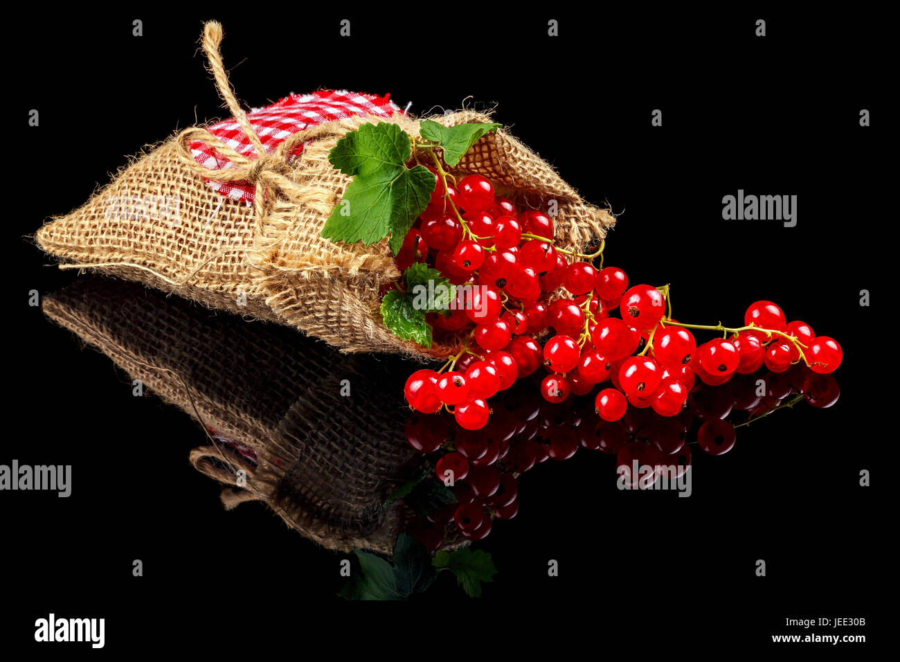 Fruits of red currants on a dark background. Close-up Stock Photo