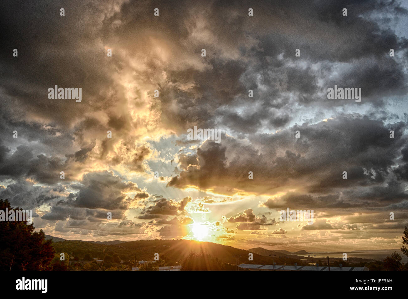 Sunrise with a partly cloudy sky Stock Photo Alamy