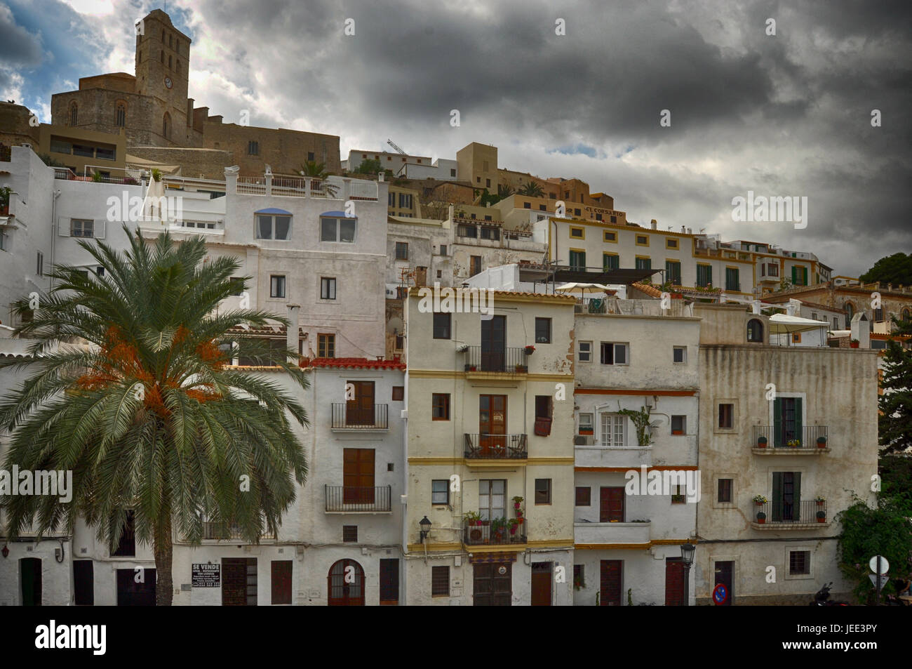 Bottom view of Ibiza white houses and cathedral. Stock Photo