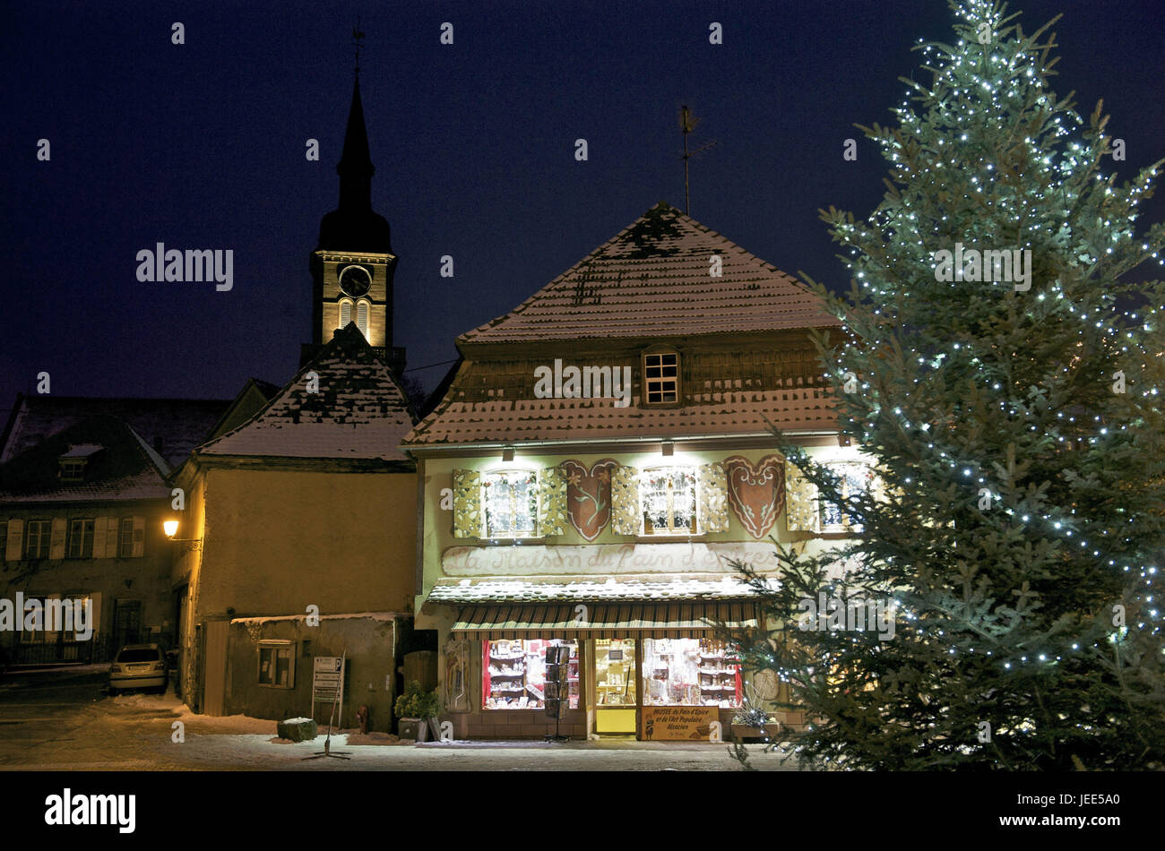 France, Bas-Rhin, Gertwiller, baker's Lips, building with Christmas lighting and Christmas tree, Stock Photo