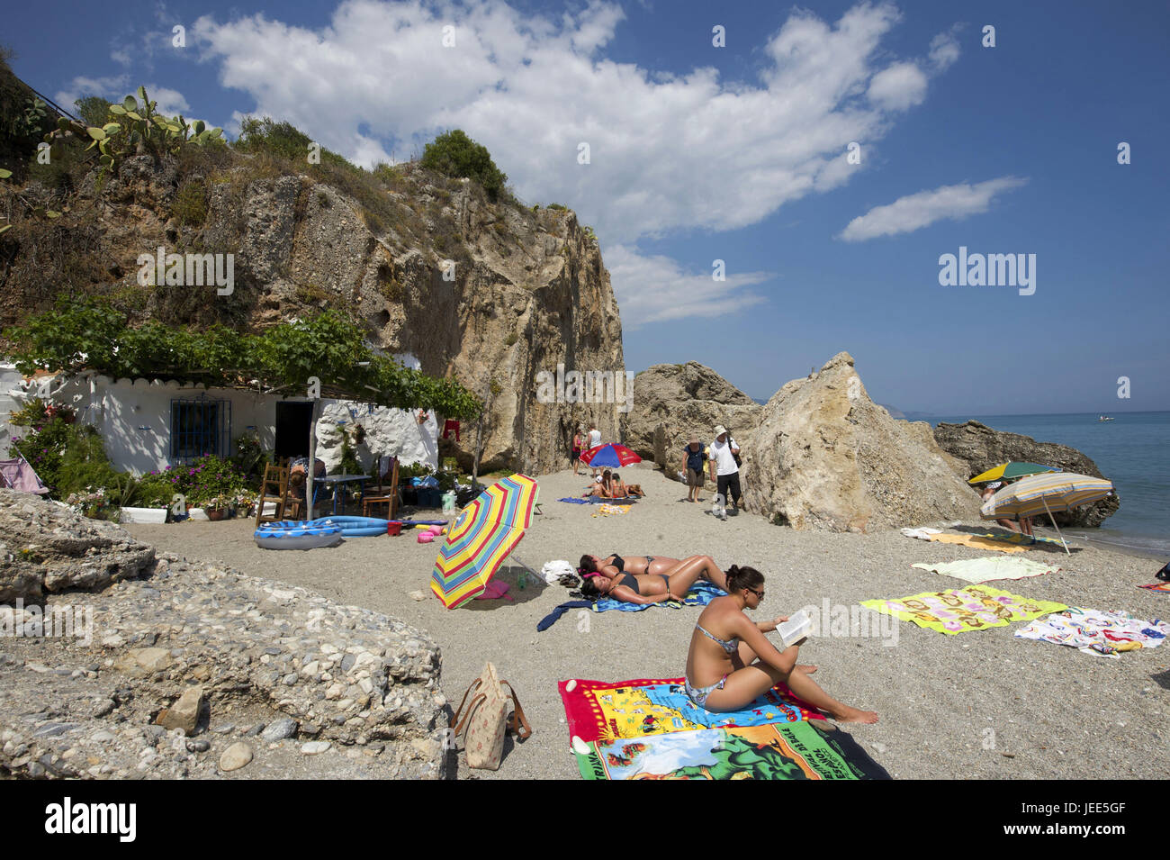 Spain, Andalusia, Costa del Sol, Nerja, vacationer in the sandy beach, Stock Photo