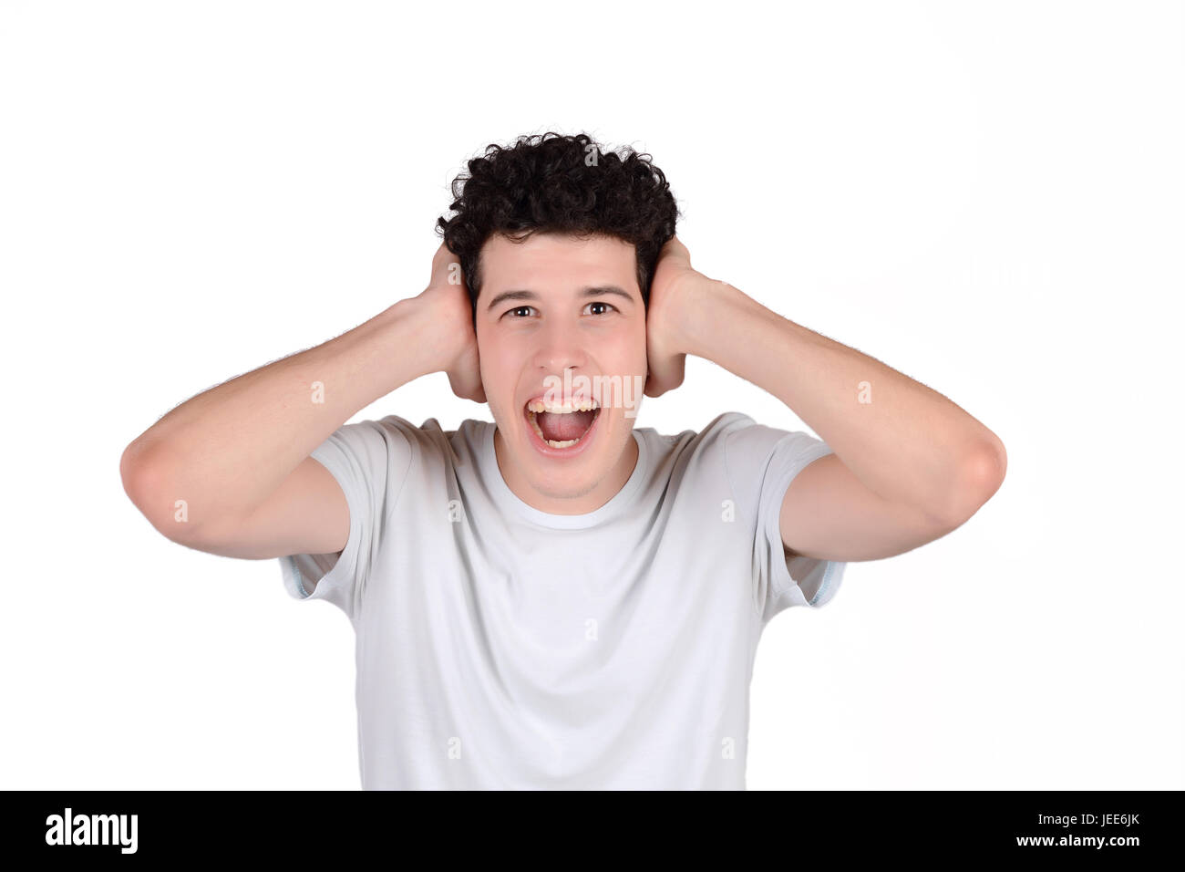 Portrait of a young amazed man. Isolated white background Stock Photo ...