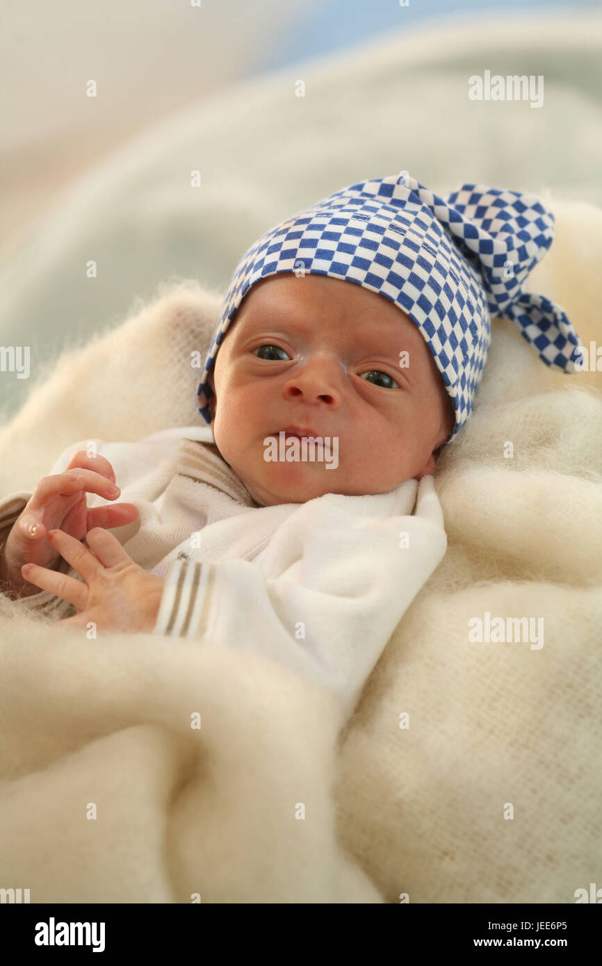 Baby, newborn child, 1 week, soft caps, facial play, Stock Photo
