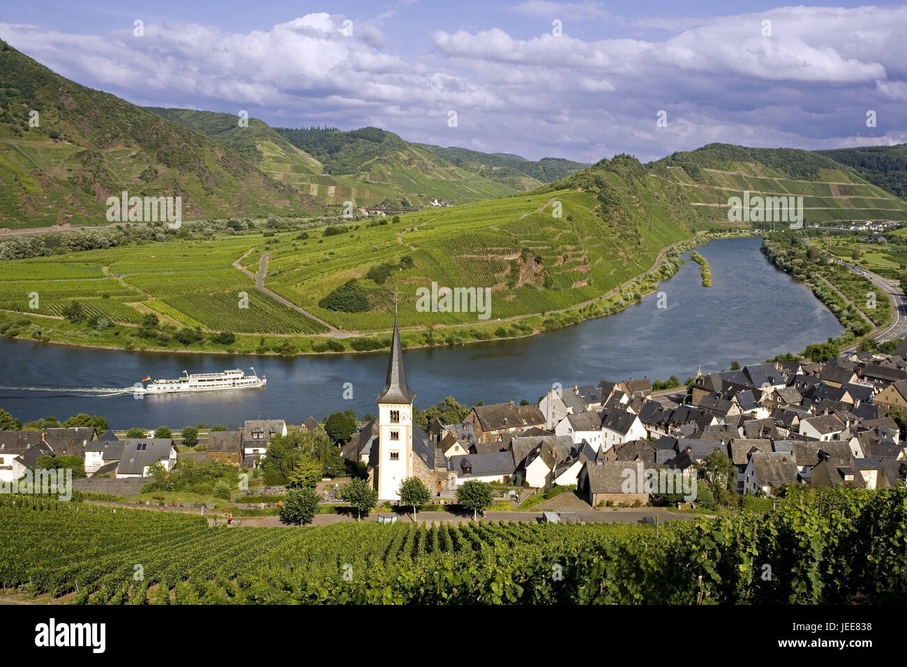 Germany, Rhineland-Palatinate, Bremm, local overview, church, the Moselle, holiday ship, Moselle valley, Moselle loop, place, houses, residential houses, parish church, flux loop, river, ship, riverboat journey, wine region, viticulture, wine-growing area, vineyards, destination, tourism, Stock Photo