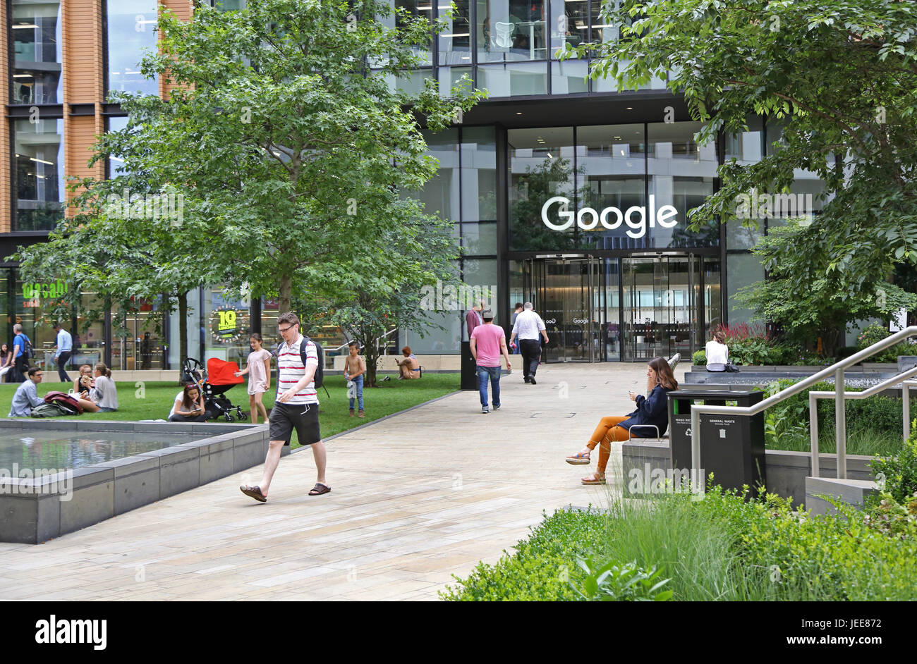 The entrance to Google's new UK headquarters building in St Pancras Square, London. Shows Google sign above door. Stock Photo