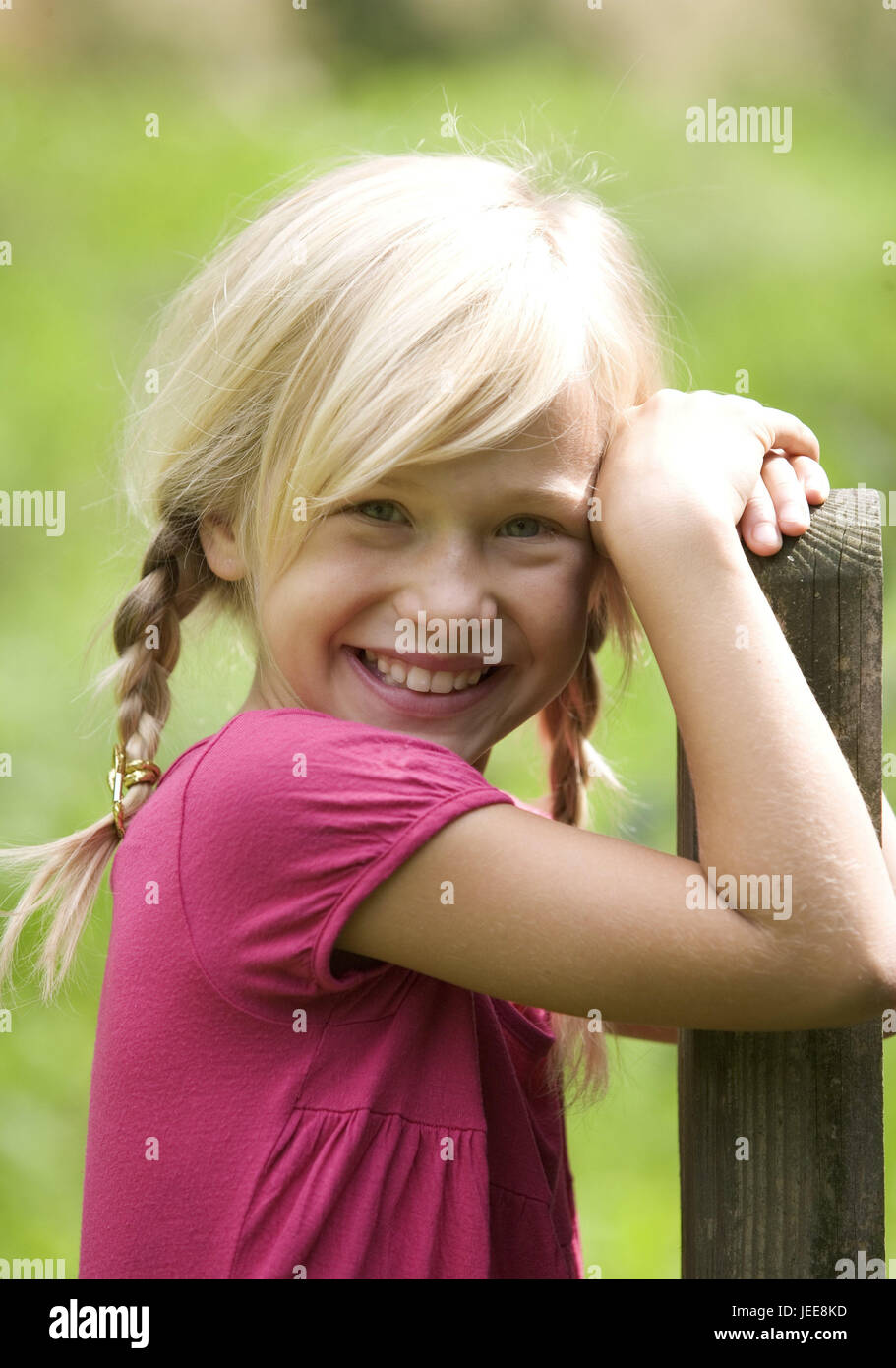 Girls, smile, lean wooden post, portrait, person, child, blond, long-haired, plaits, arms, lean, expression, happily, happily, joy, fun, outside, Stock Photo
