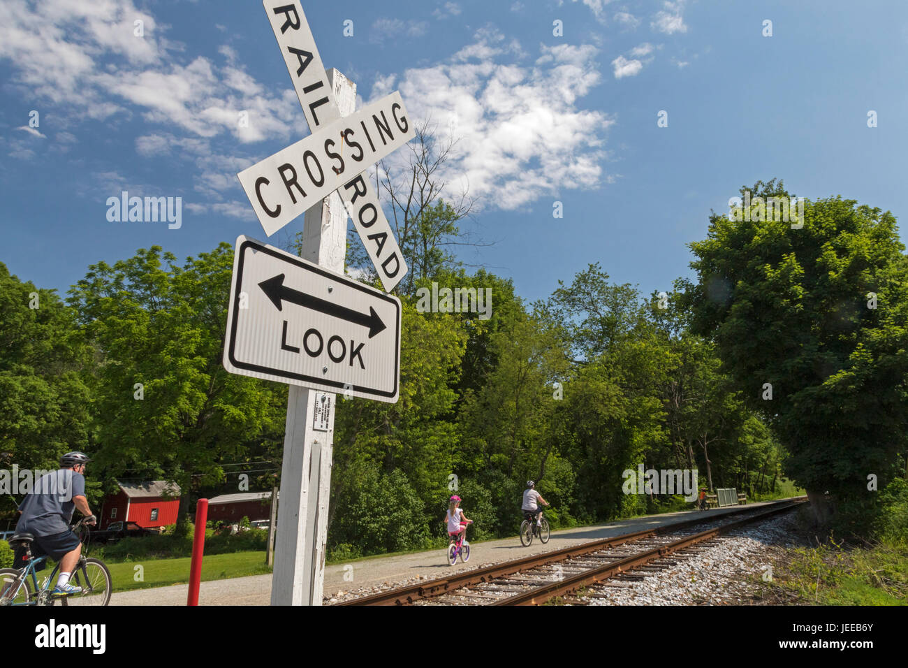 Railroad, Pennsylvania - People ride bicycles on the Heritage Rail Trail, built alongside the former Northern Central Railroad. Scenic steam train rid Stock Photo