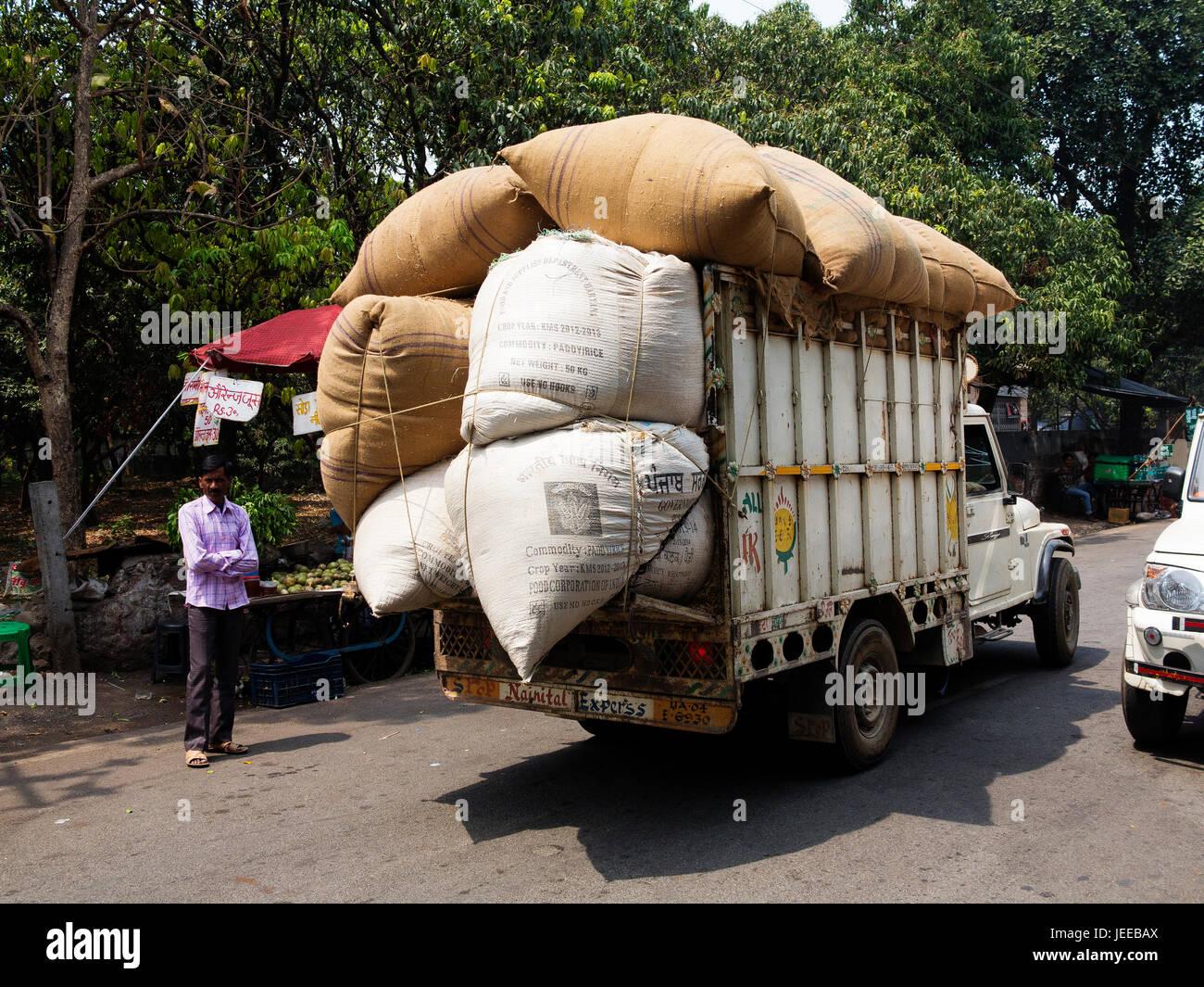 Heavilly ladden truck with agricultural products at Kaladunghi town, Uttarakhand, India Stock Photo