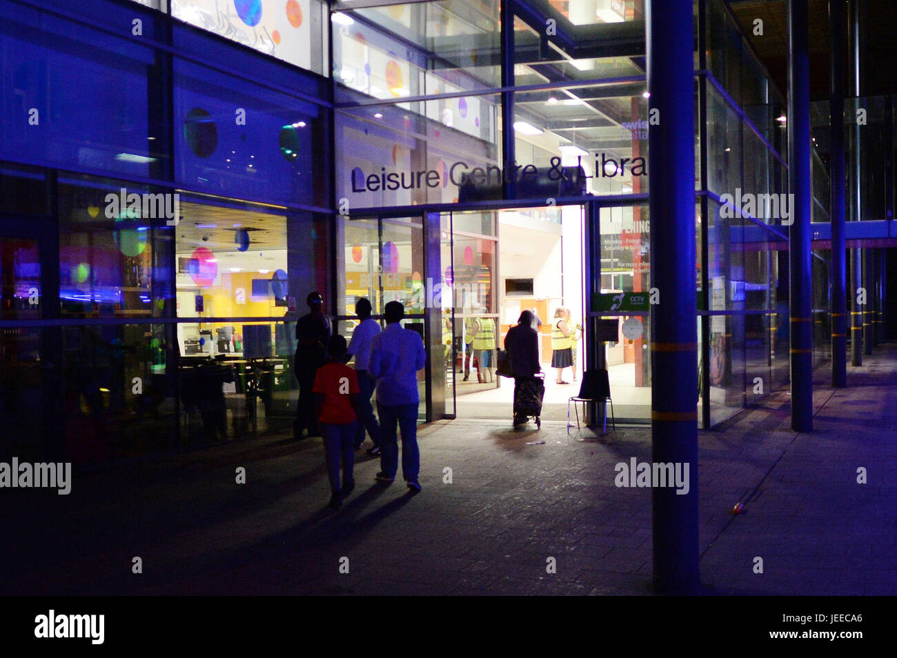 People Arrive At Swiss Cottage Leisure Centre And Library Which