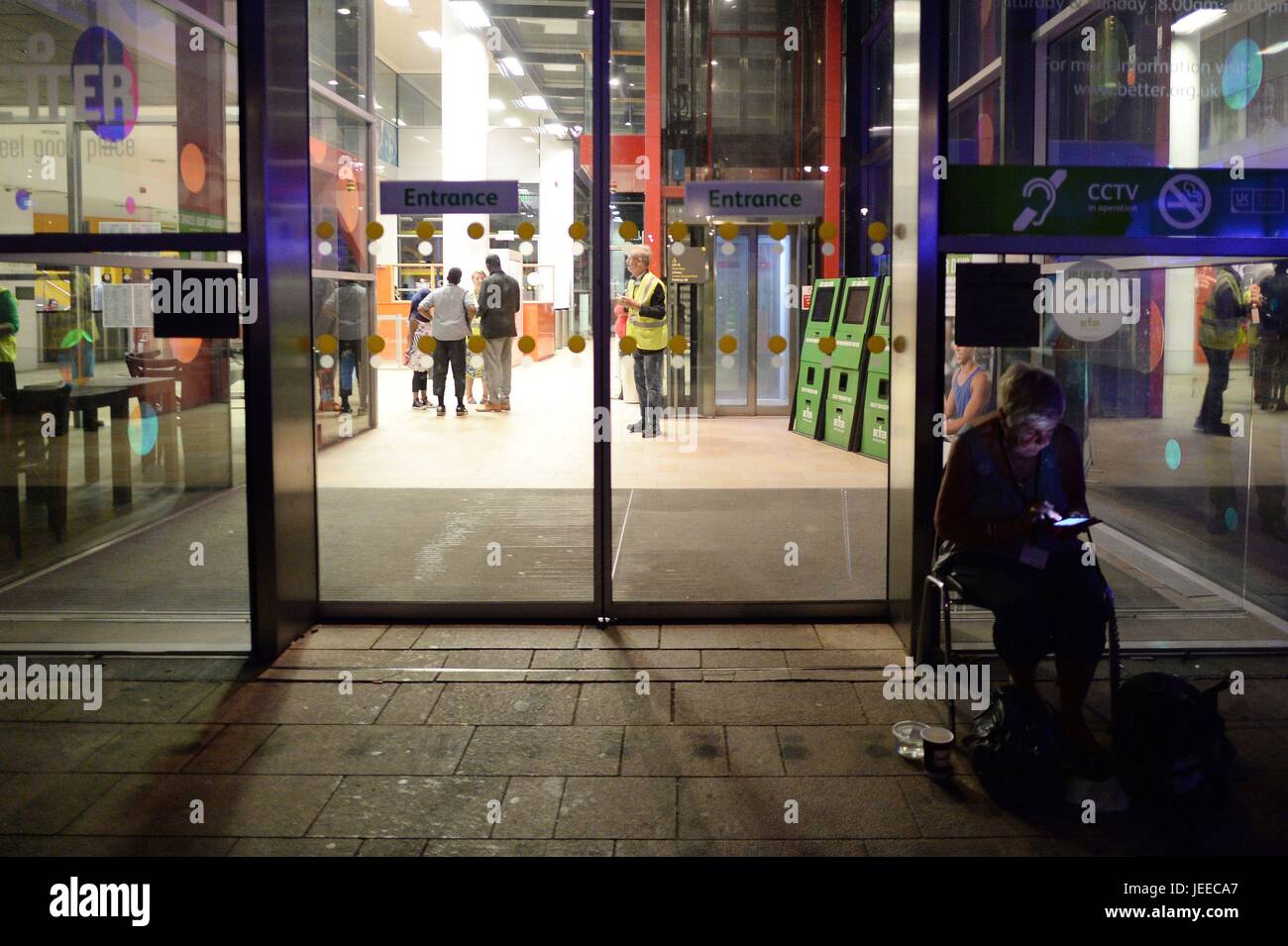 People Arrive At Swiss Cottage Leisure Centre And Library Which