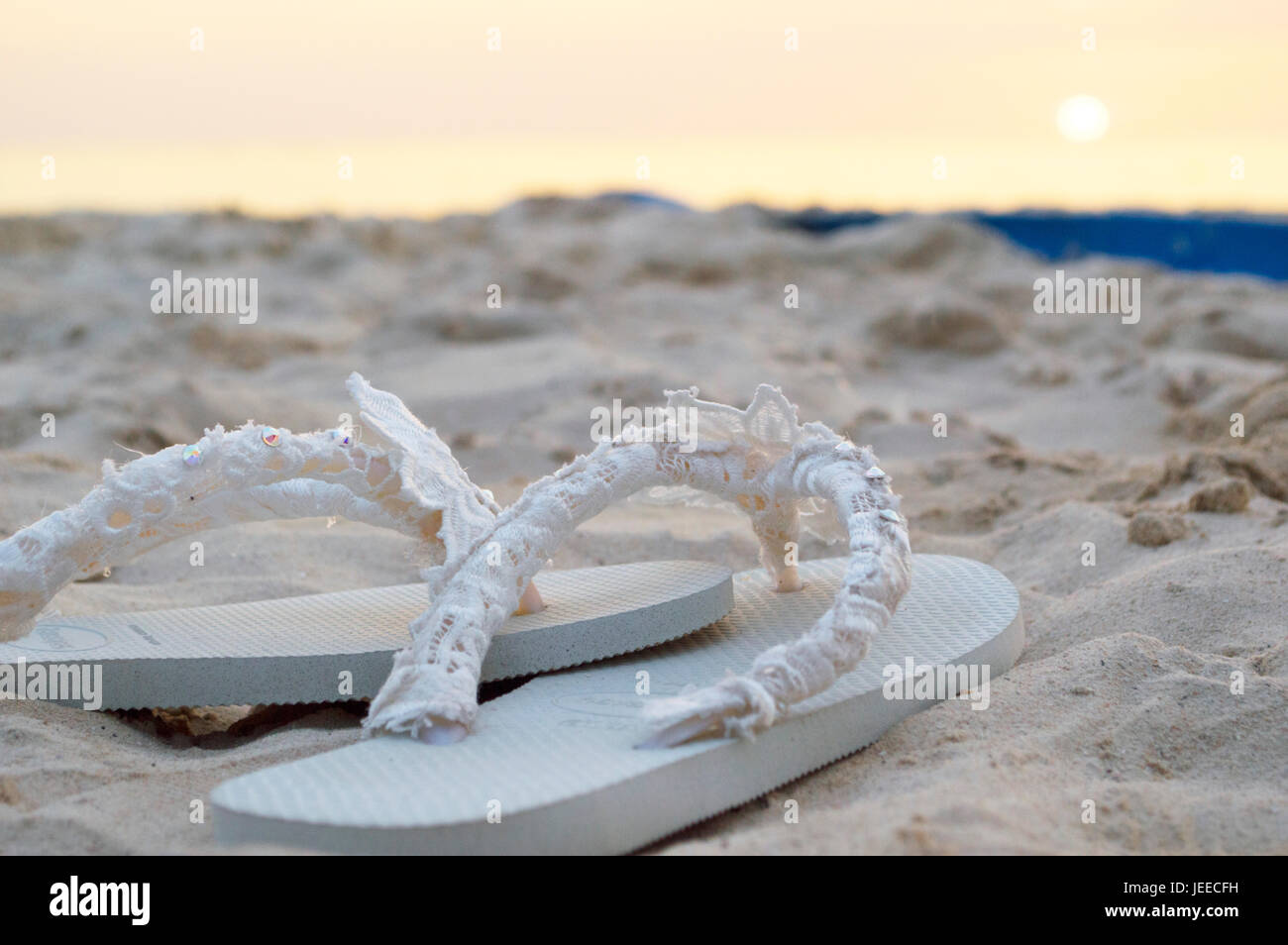 Flip flops on the beach Stock Photo - Alamy