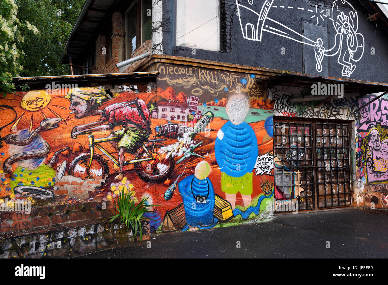 Graffiti on wall at Metelkova City Autonomous Cultural Center squat at former Yugoslav National Army military barracks in Ljubljana Slovenia Stock Photo