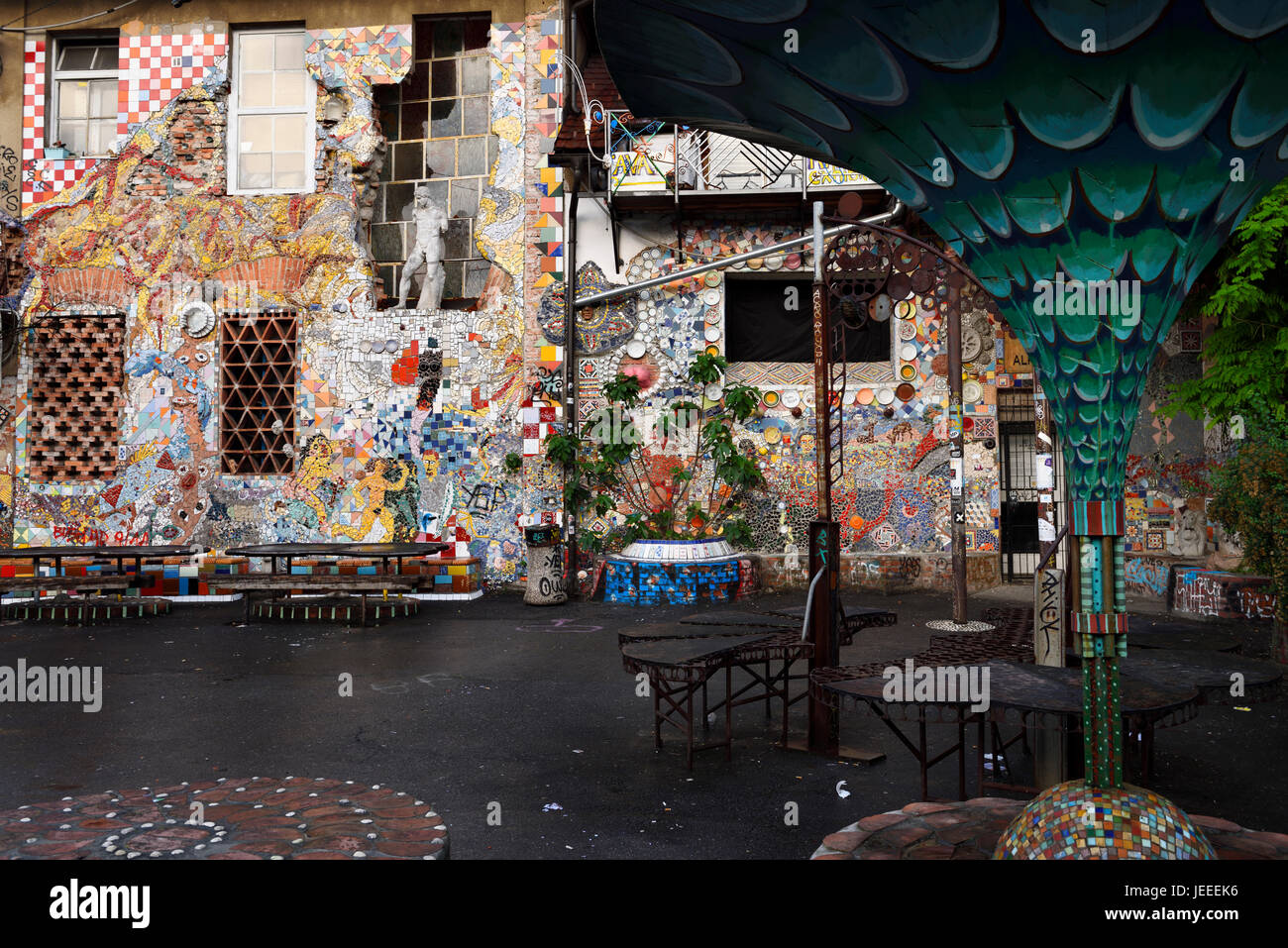 Wall mosaic and patio at Metelkova City Autonomous Cultural Center squat at former Yugoslav National Army military barracks in Ljubljana Slovenia Stock Photo