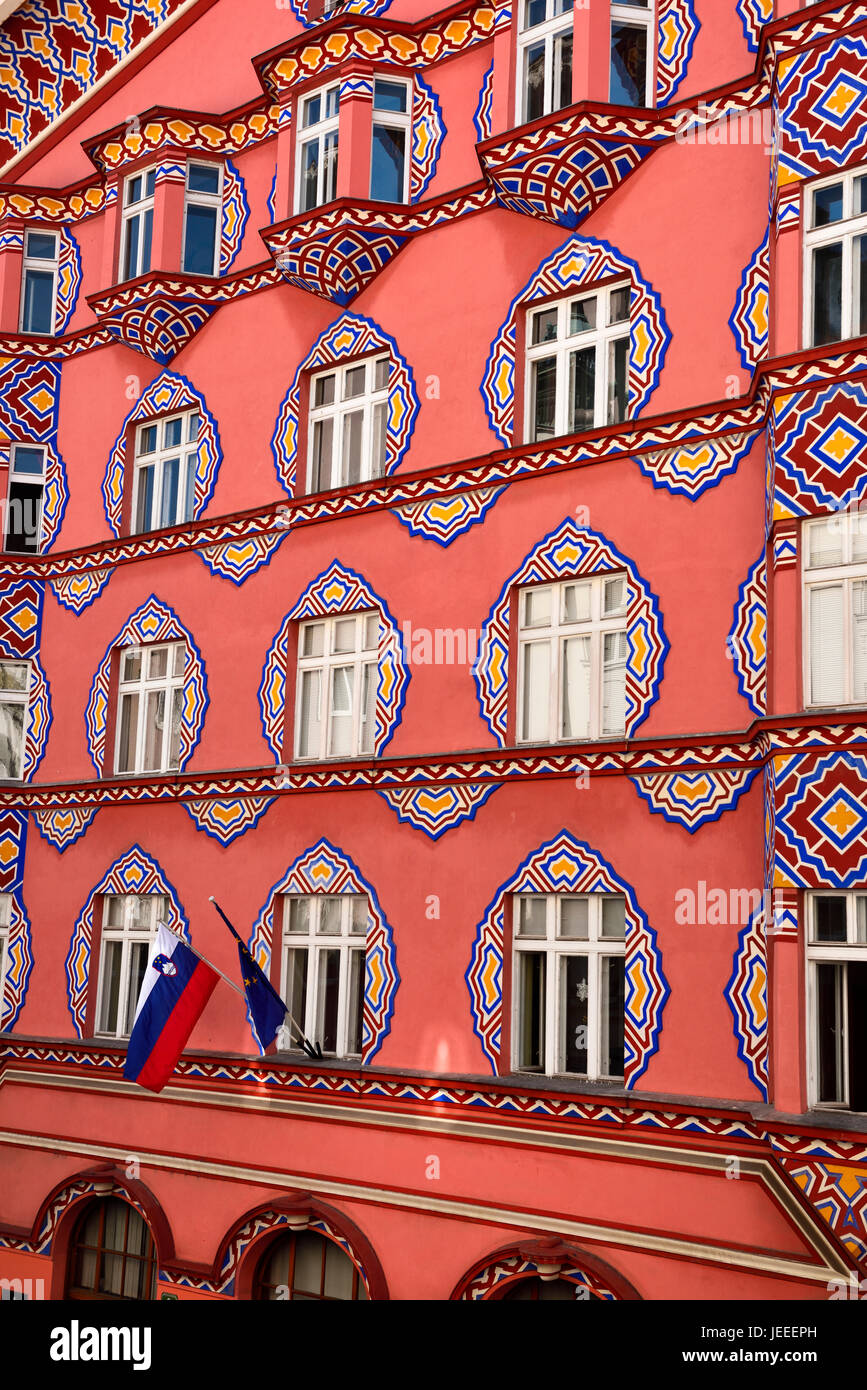 Brightly colored facade of Cooperative Business Bank Building or Vurnik House by Ivan Vurnik 1921 painted by wife Helena in Ljubljana Slovenia Stock Photo