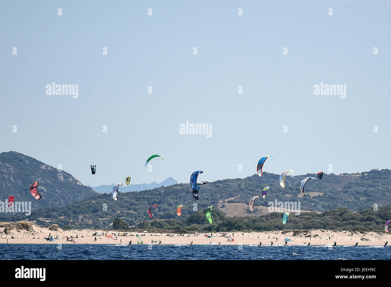 Kite surfers at sunset on Porto Pollo, Sardinia, Italy Stock Photo