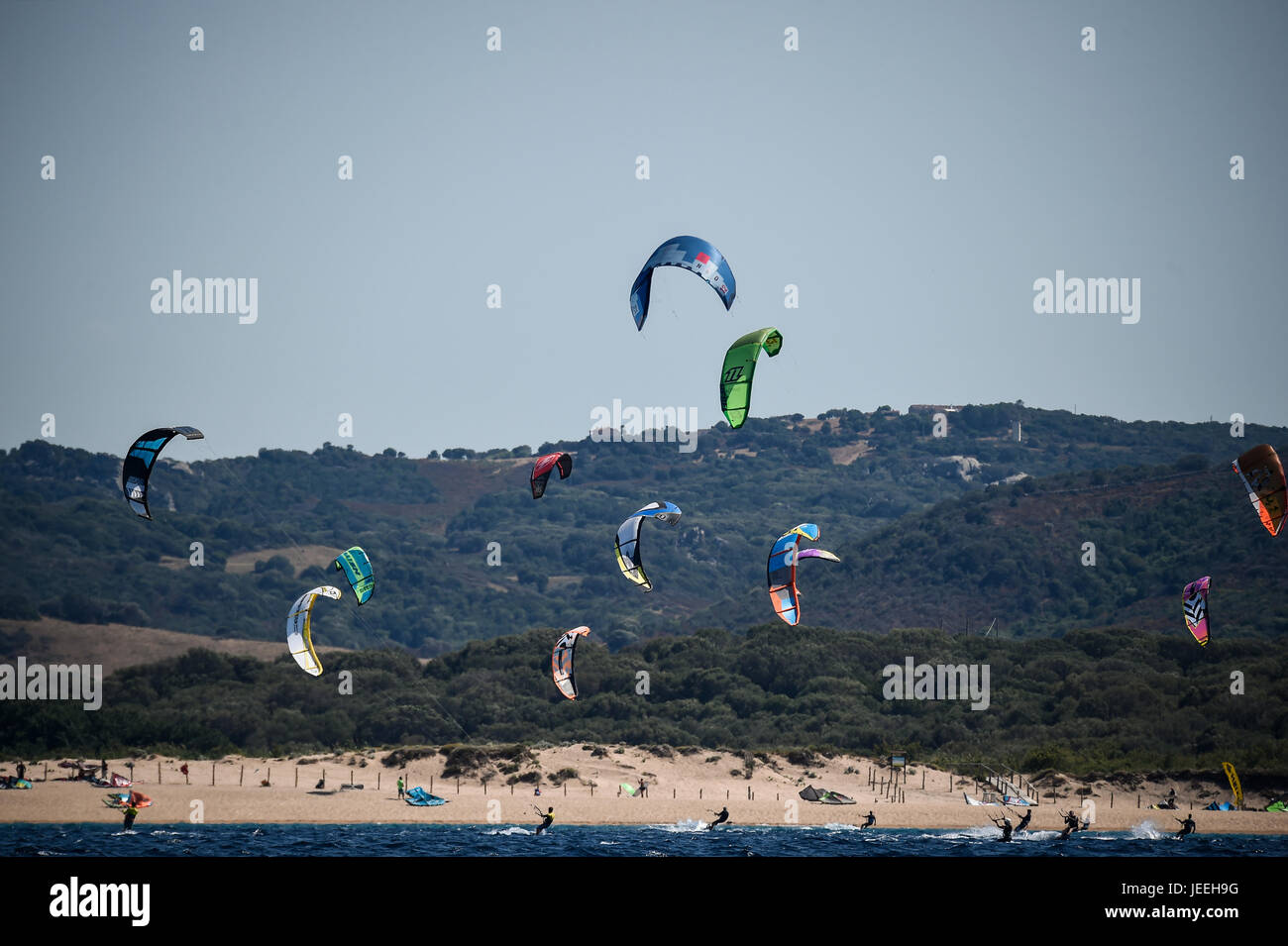 Kite surfers at sunset on Porto Pollo, Sardinia, Italy Stock Photo