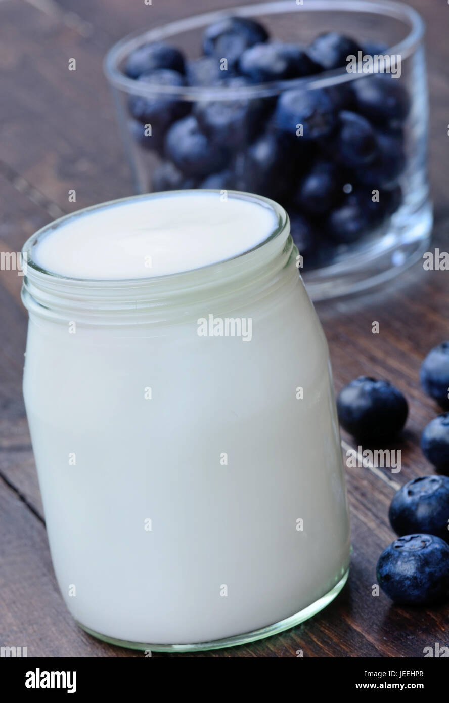 Yogurt and blueberry on wooden table Stock Photo