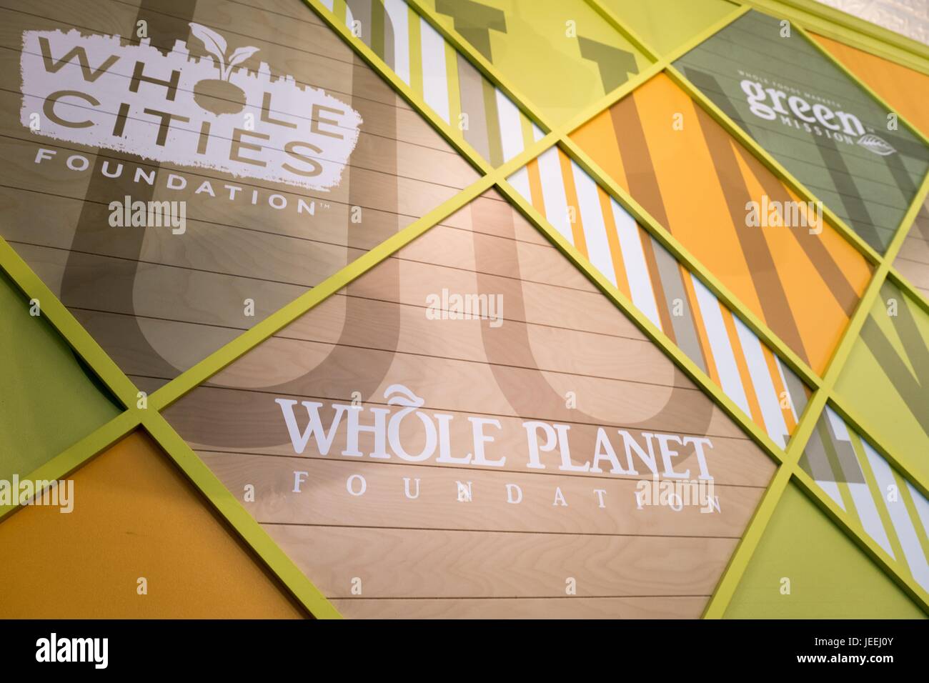Signage for the Whole Planet Foundation, Whole Cities Foundation, and other charitable foundations at the Whole Foods Market grocery store in Dublin, California, June 16, 2017. Stock Photo