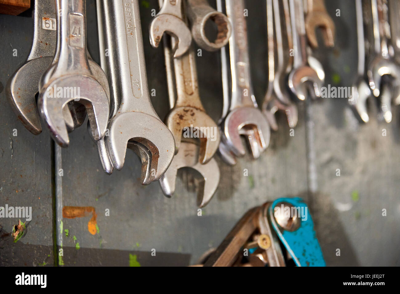 different wrenches hanging on wall Stock Photo Alamy