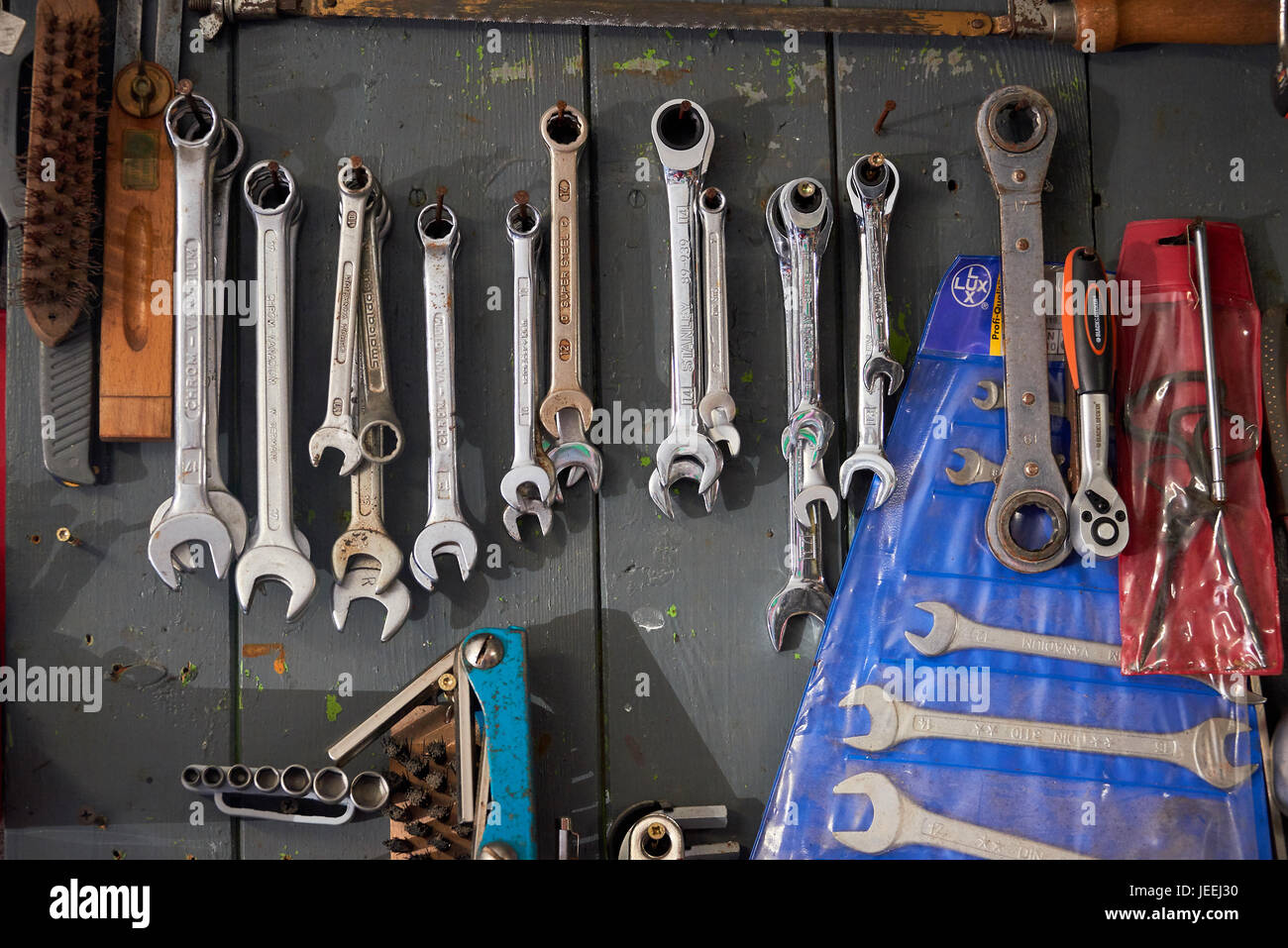 different wrenches hanging on wall Stock Photo Alamy