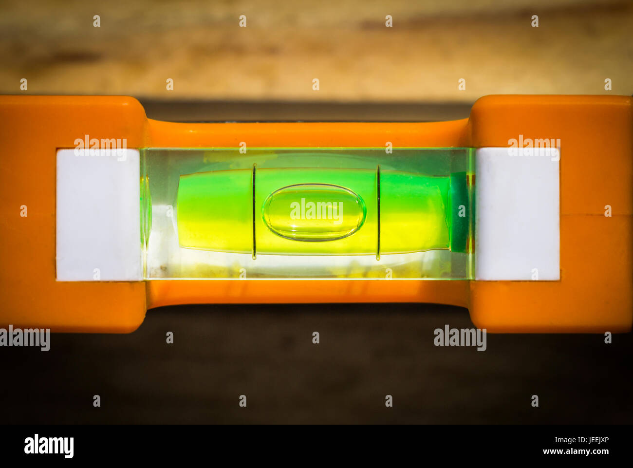Green bubble level building tool measuring closeup Stock Photo Alamy