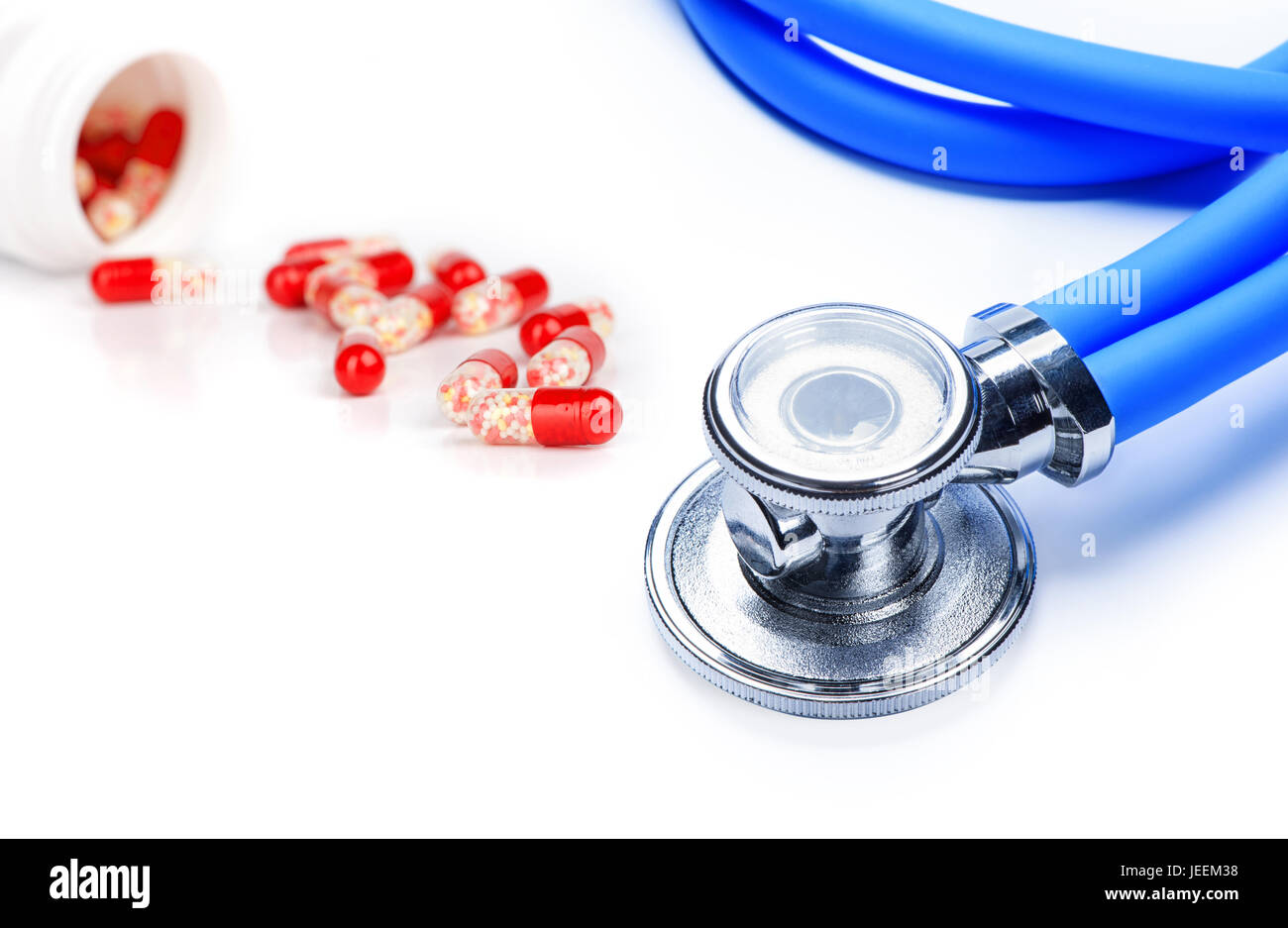 stethoscope with tablets isolated on white background Stock Photo - Alamy