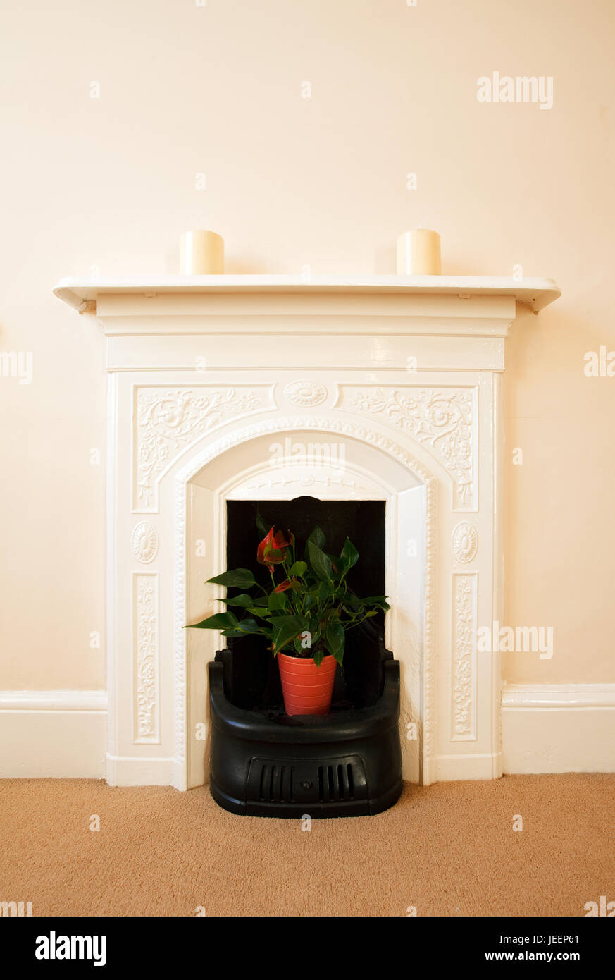 Traditional English Fireplace. A traditional ornate iron fireplace from