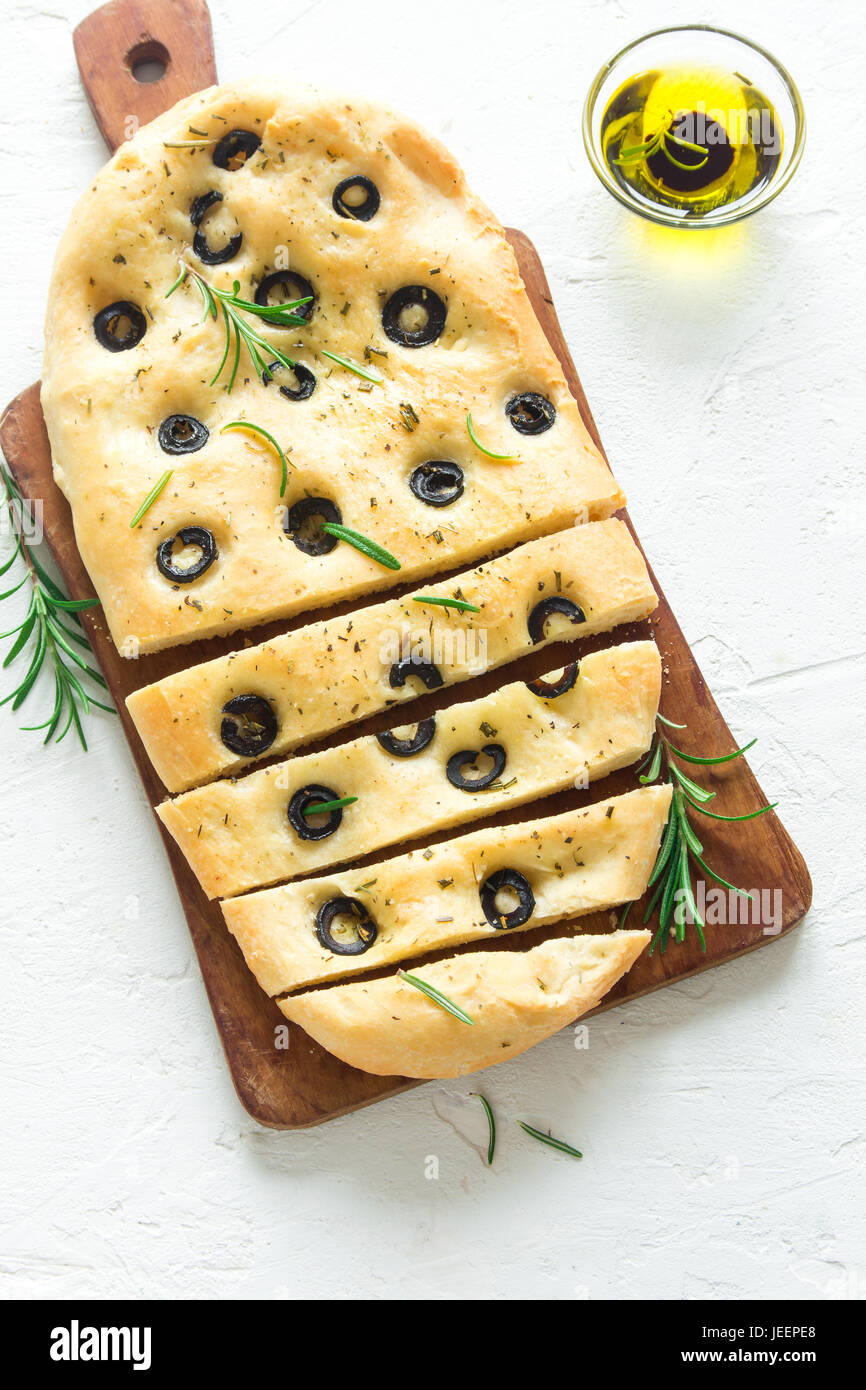Traditional Italian Focaccia with black olives and rosemary homemade