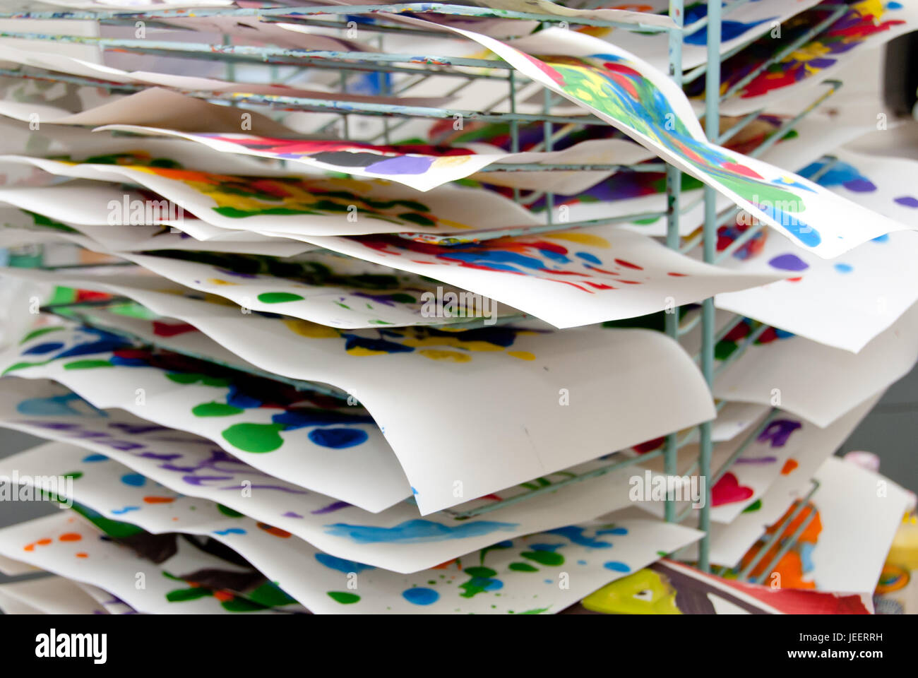 Rack of Children's Paintings and Artwork Drying Stock Photo Alamy