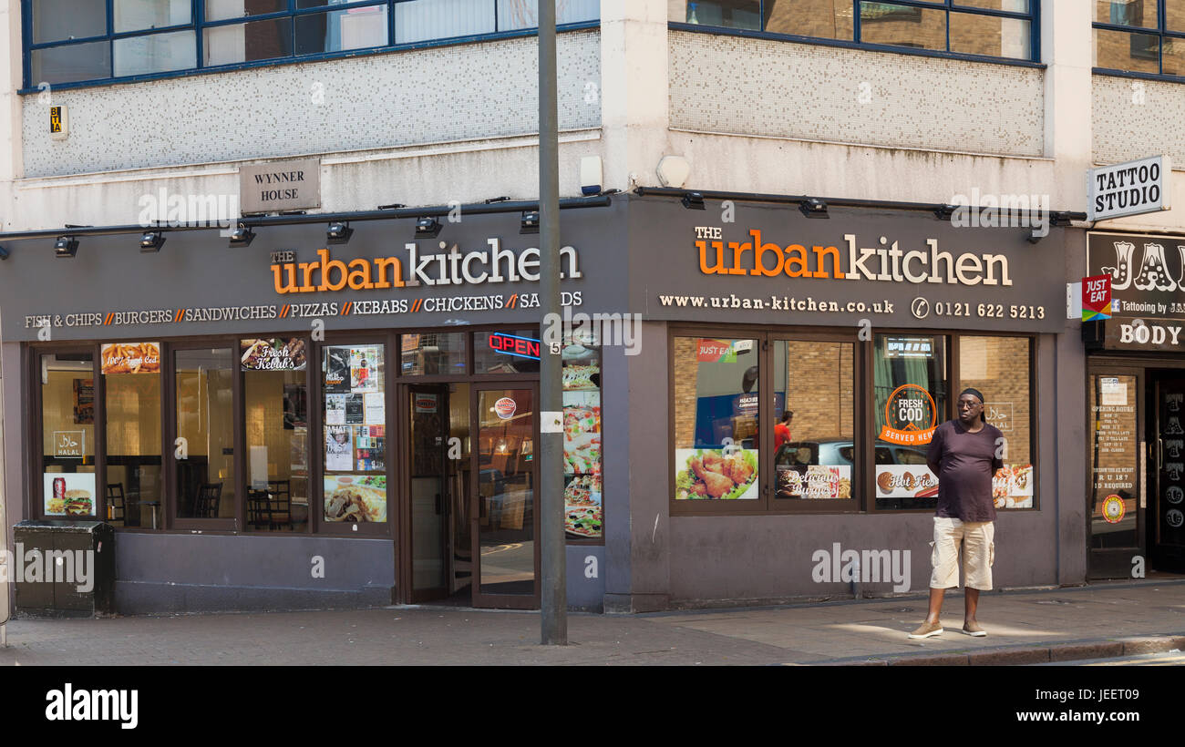 Man standing outside The Urban Kitchen, fast food restaurant in Hurst