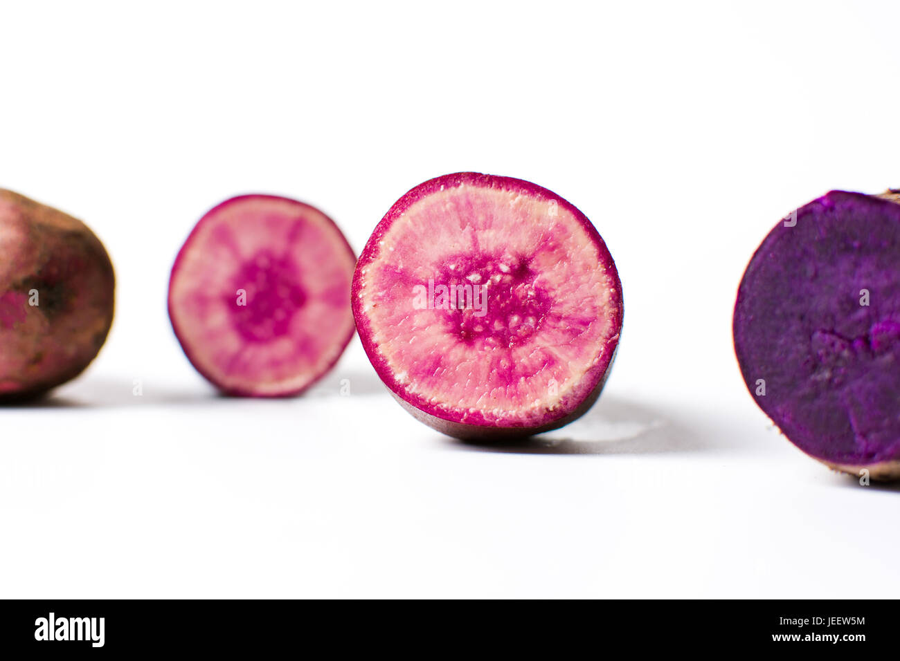 Purple potatoes isolated on white background. Healthy food Stock Photo