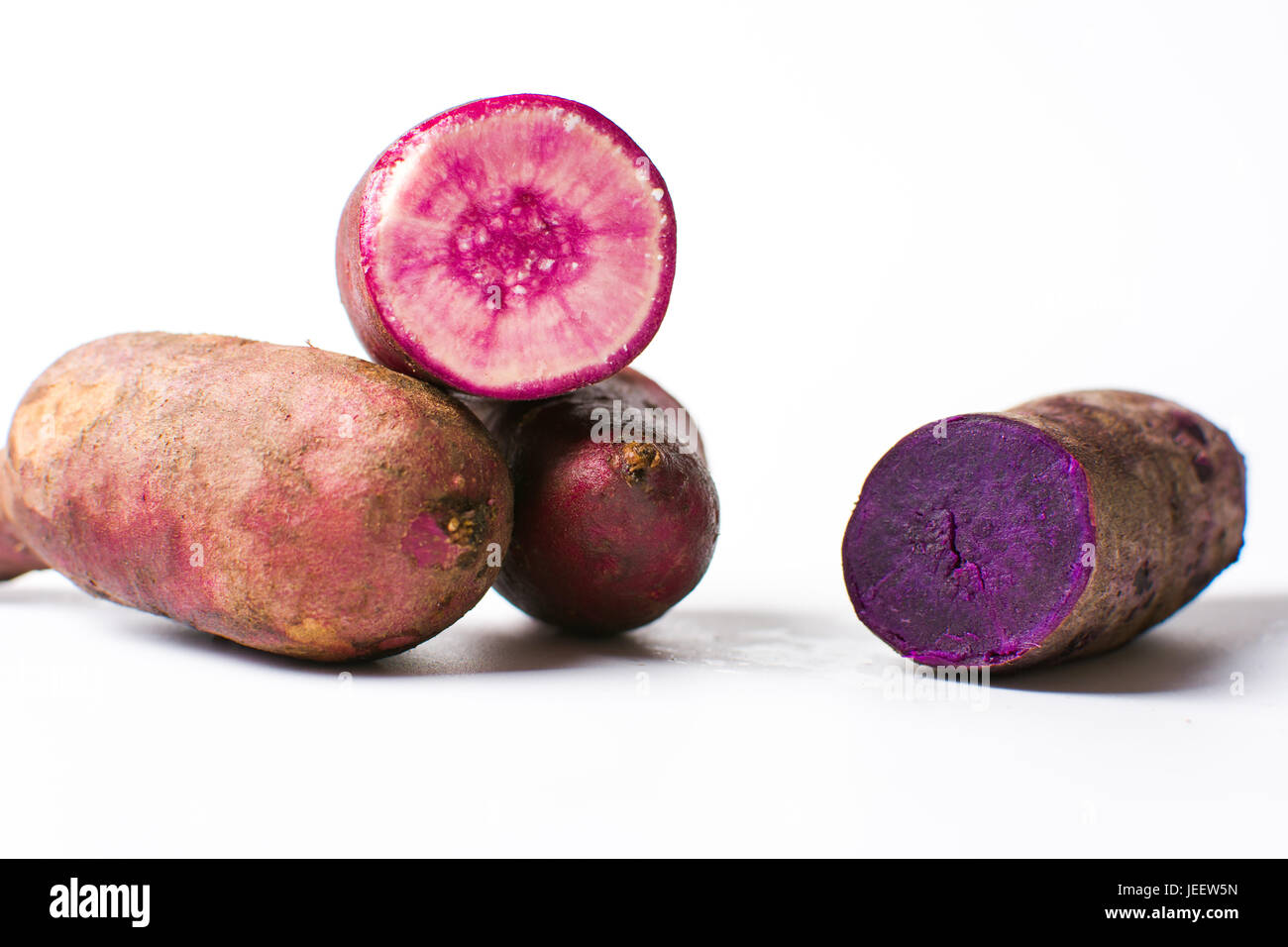 Purple potatoes isolated on white background. Healthy food Stock Photo