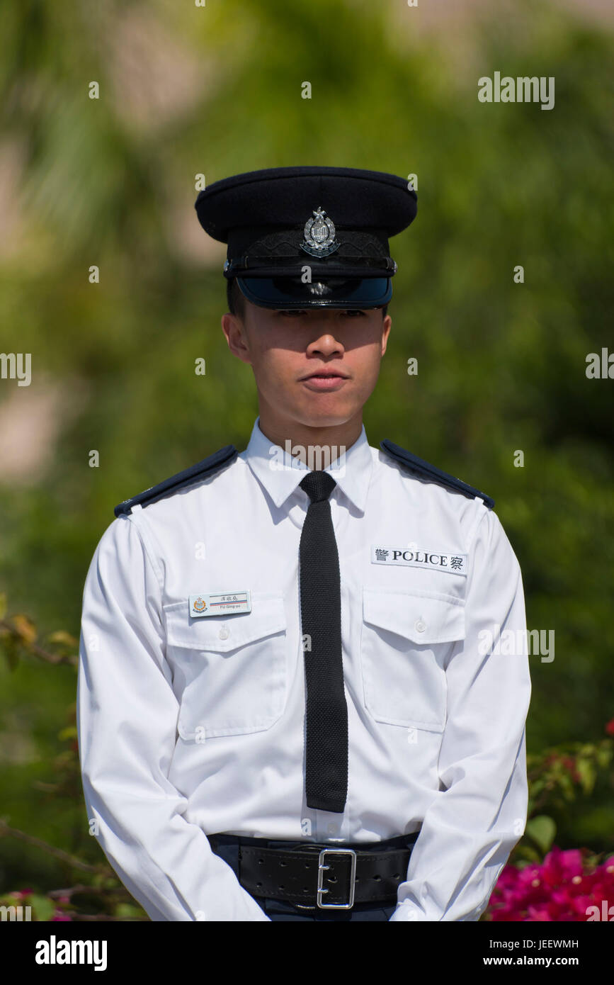 Vertical portrait of a policeman in Hong Kong, China. Stock Photo