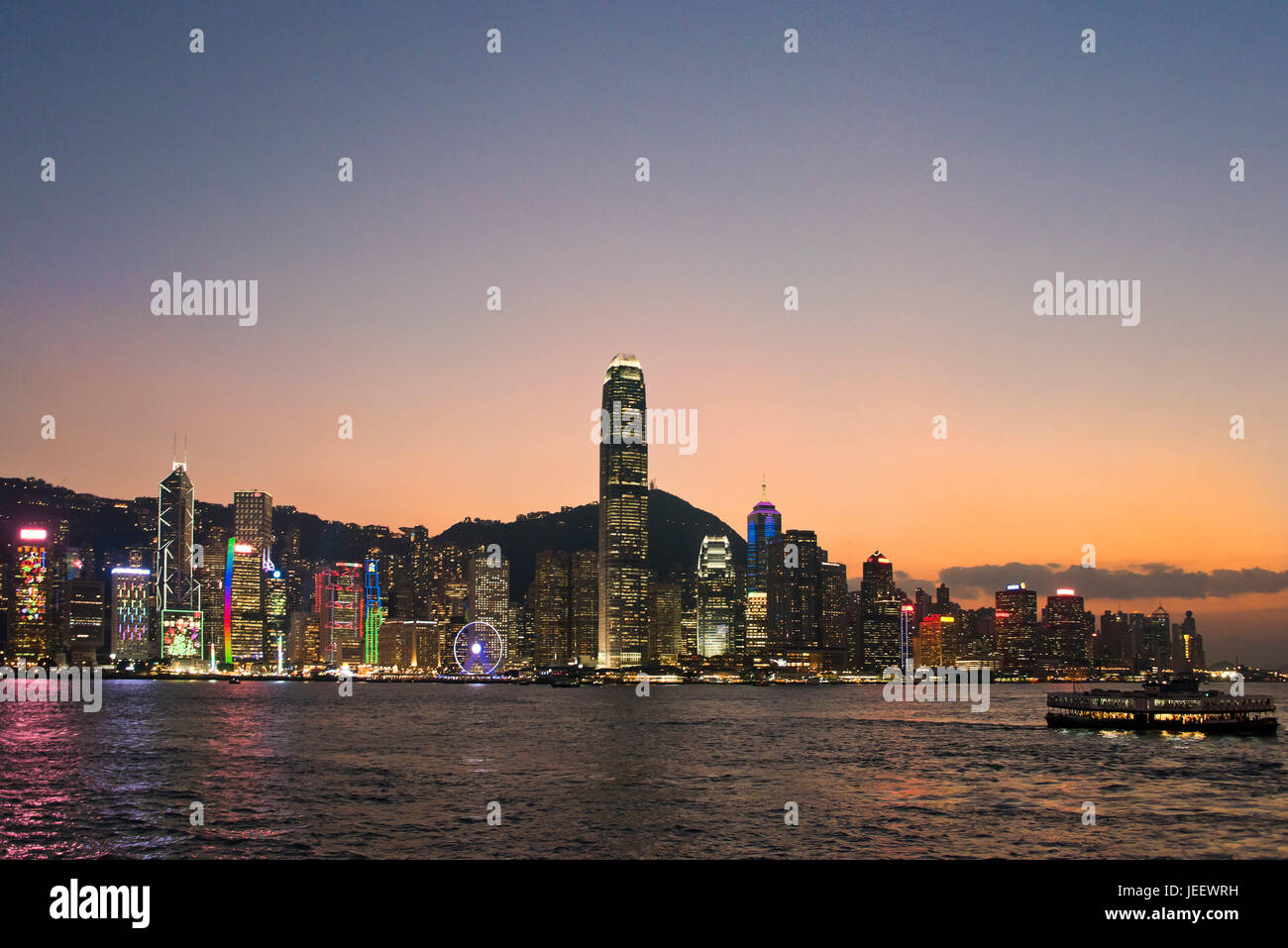 Horizontal cityscape of Hong Kong Island lit up at sunset, China Stock ...