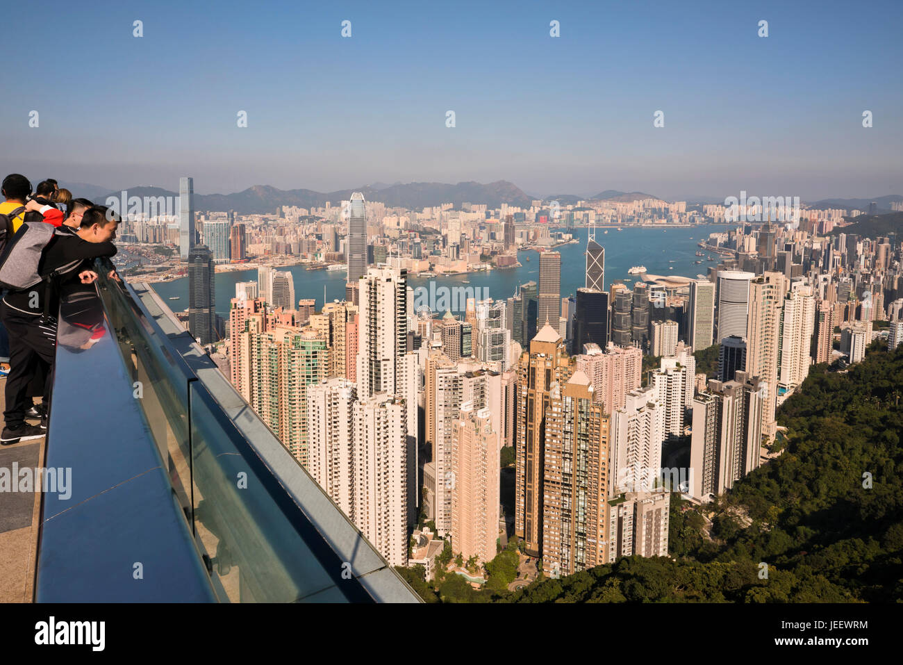 Horizontal view of people enjoying the view from up the Peak in Hong Kong, China. Stock Photo