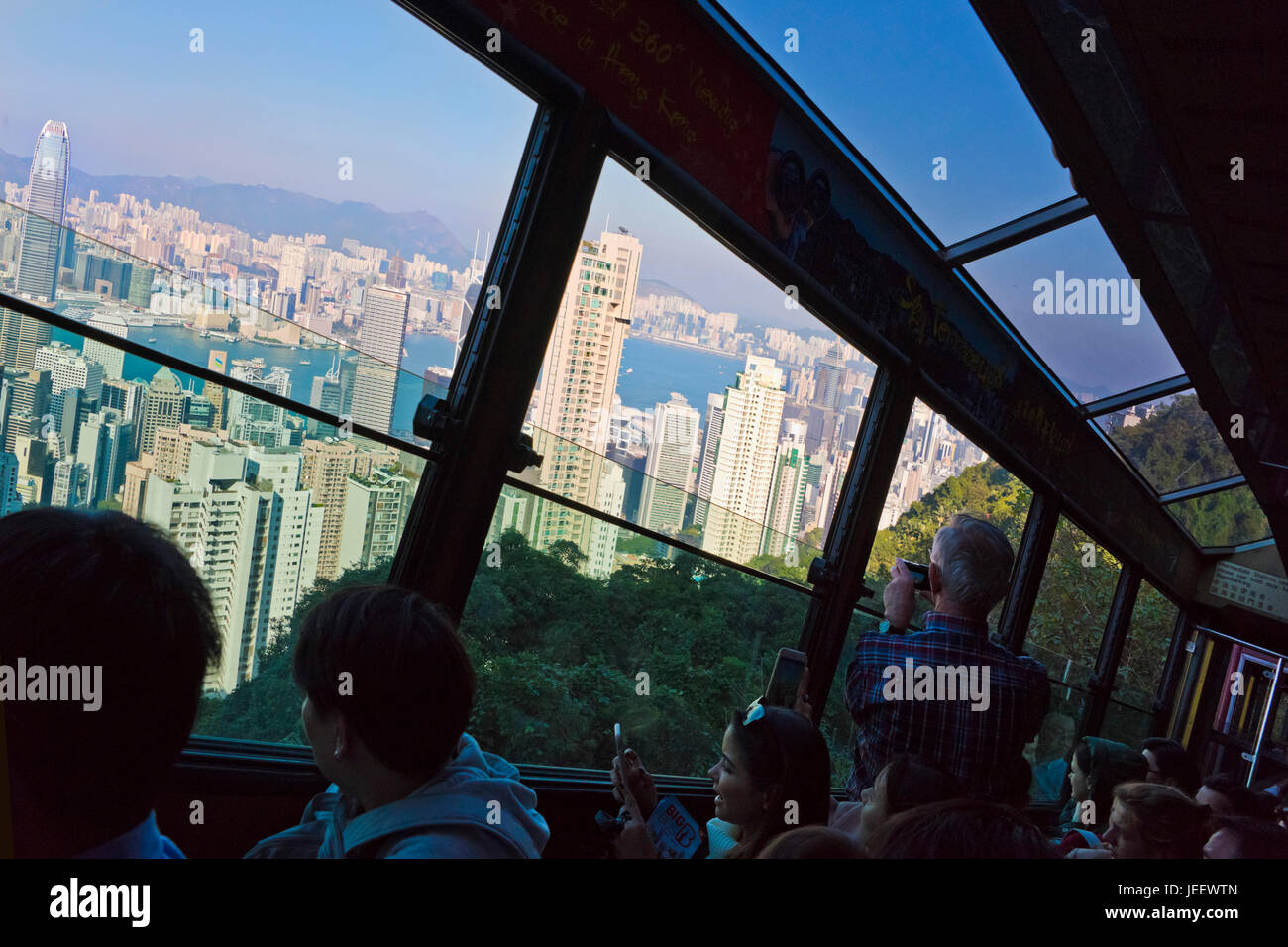 Horizontal view of passengers onboard the Peak tram in Hong Kong, China. Stock Photo