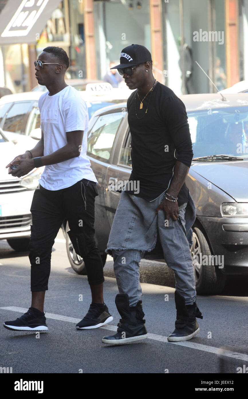 Mario Balotelli out shopping at the Puma store in Milan with his brother  Enock Barwuah. Mario Balotelli arrived in his new Alfa Romeo Giulia car.  Featuring: Mario Balotelli, Enock Barwuah Where: Milan,