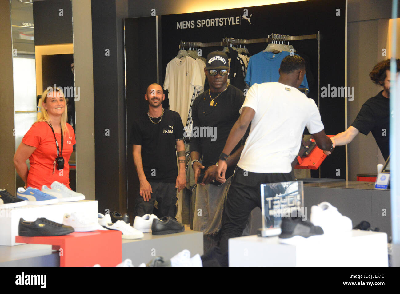 Mario Balotelli out shopping at the Puma store in Milan with his brother  Enock Barwuah. Mario Balotelli arrived in his new Alfa Romeo Giulia car.  Featuring: Mario Balotelli, Enock Barwuah Where: Milan,