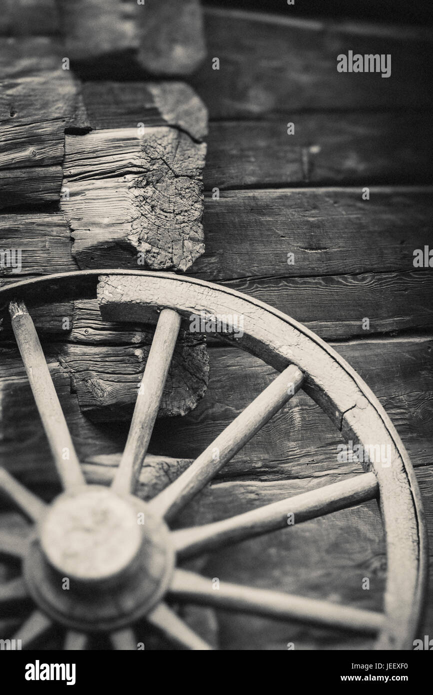 Old Wagon Wheel Outside Rural Building Wall Rustic Wooden