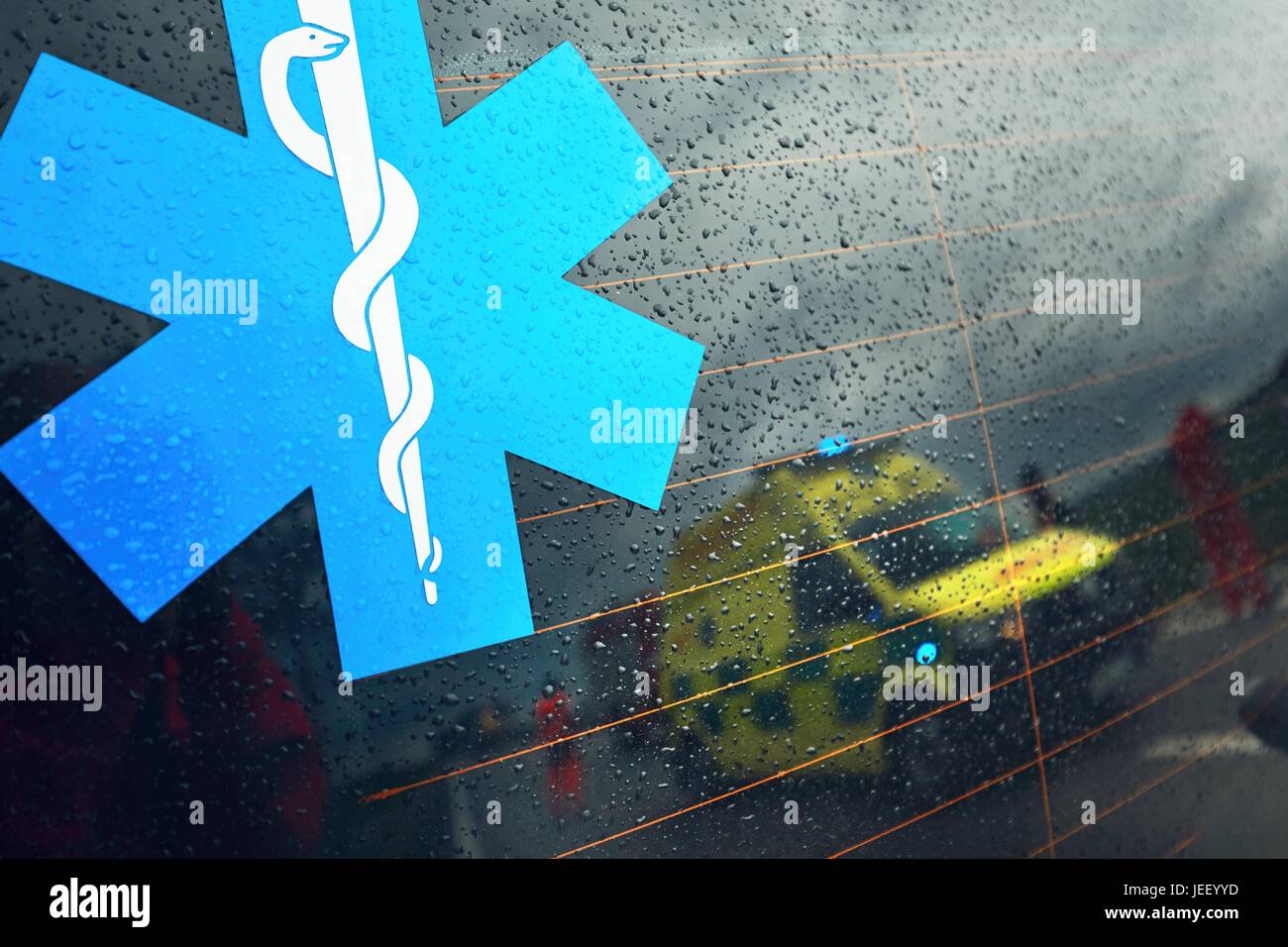 Reflection of the ambulance car. Teams of the Emergency medical service